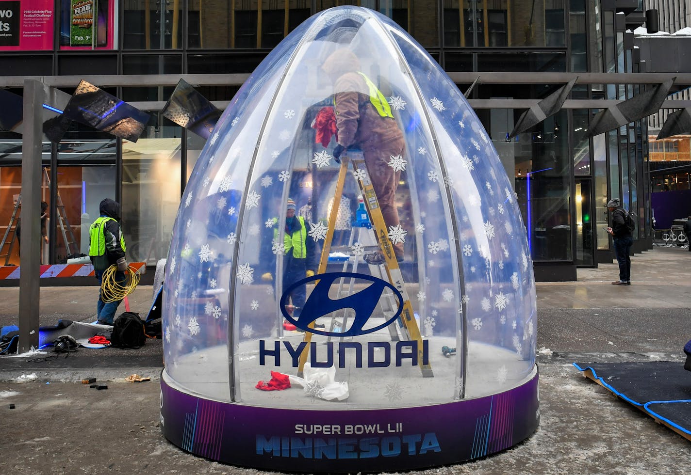 Hyundai human snow globe on Nicollet Mall. ] GLEN STUBBE &#x2022; glen.stubbe@startribune.com Thursday, January 25, 2018 Corporate presence on Nicollet Mall as they finish up work on getting it ready for Super Bowl Live, which officially kicks off Friday afternoon.