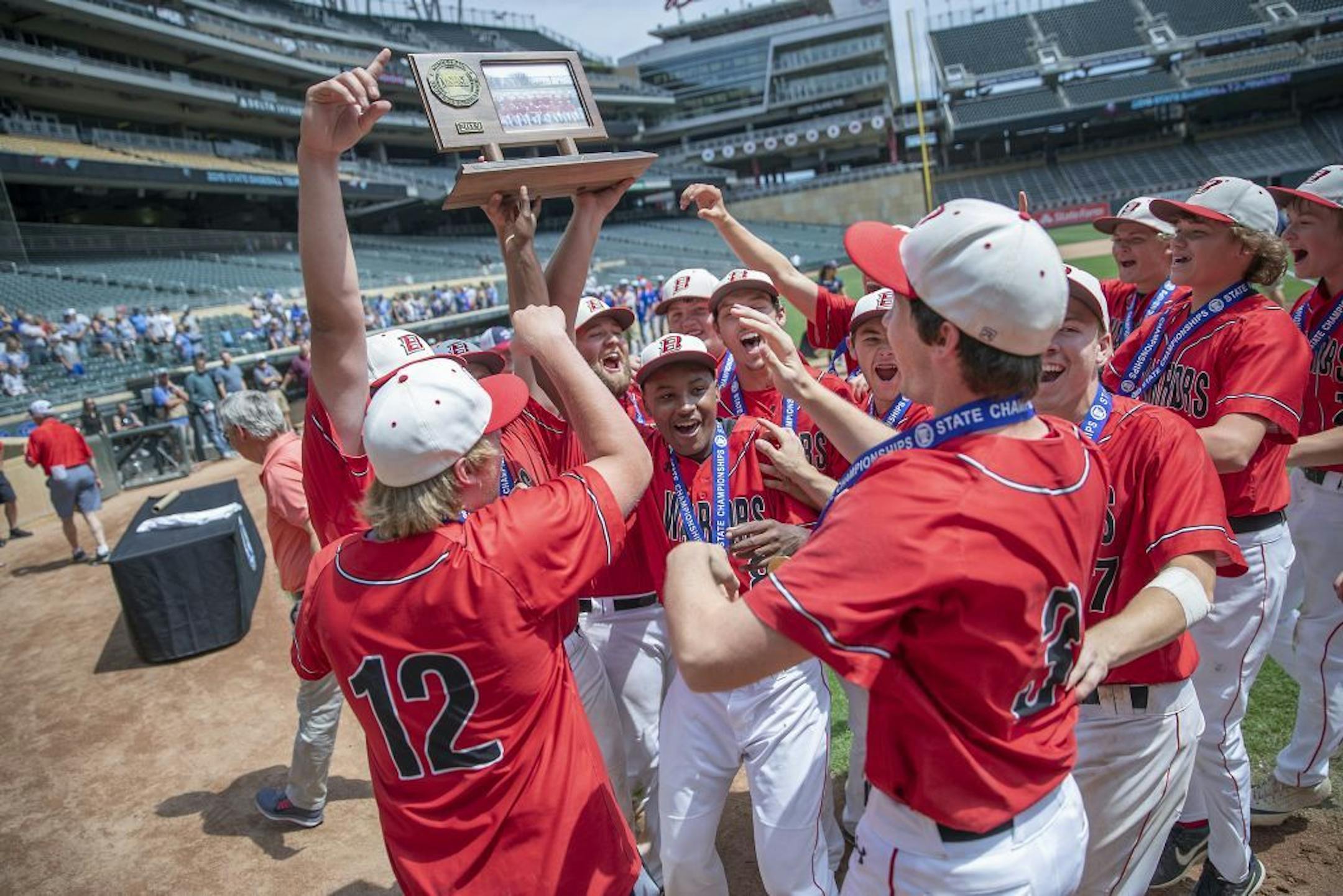 BOLD baseball players celebrated their 8-0 win over New York Mills in the Class A MN High School Boys Baseball championship game at Target Field, Thursday, June 20, 2019 in Minneapolis, MN.