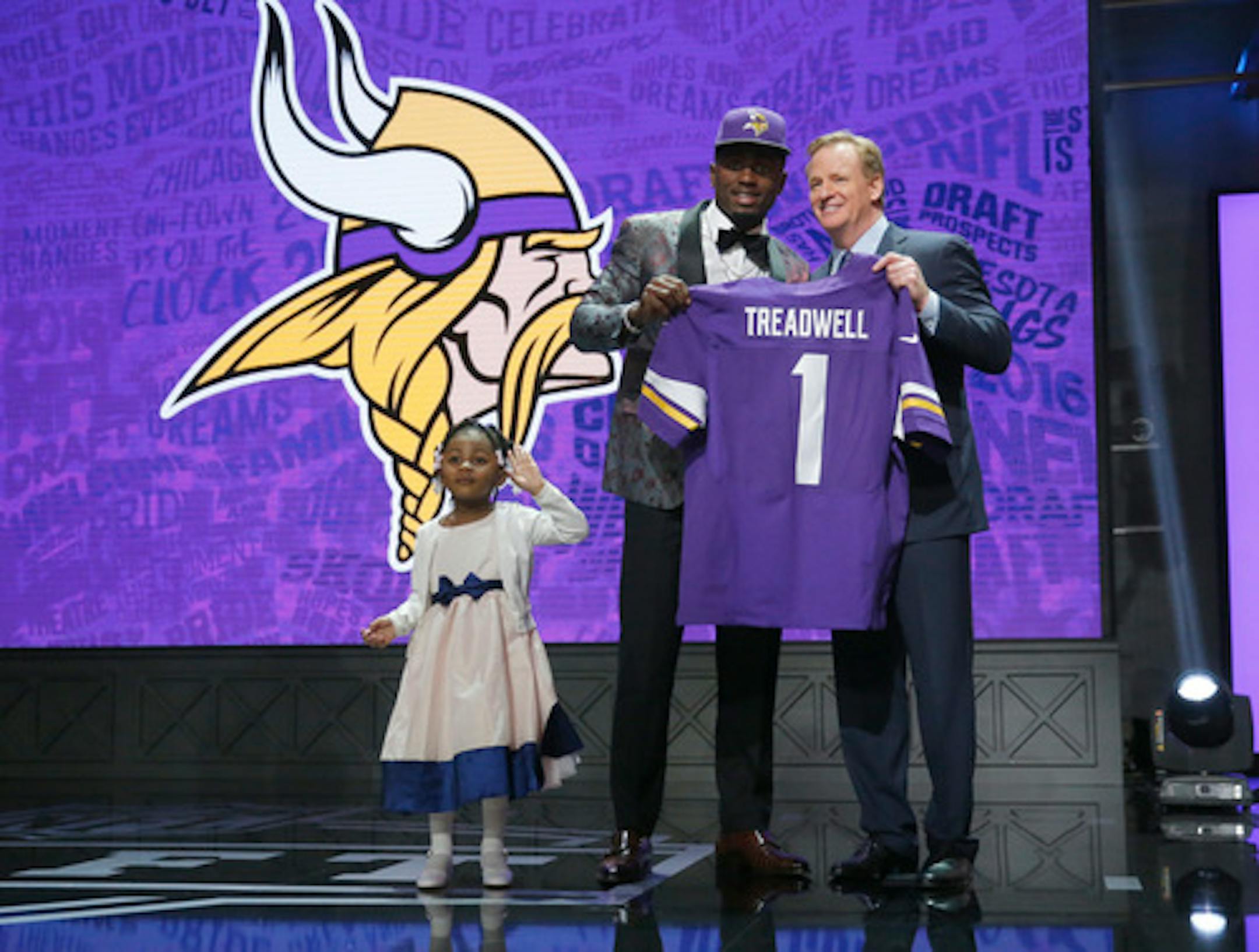 Mississippi's Laquon Treadwell poses for photos with NFL Commissioner Roger Goodell and his daughter Madison after being selected by Minnesota Vikings as the 23rd pick in the first round of the 2016 NFL football draft, Thursday, April 28, 2016, in Chicago. (AP Photo/Charles Rex Arbogast)