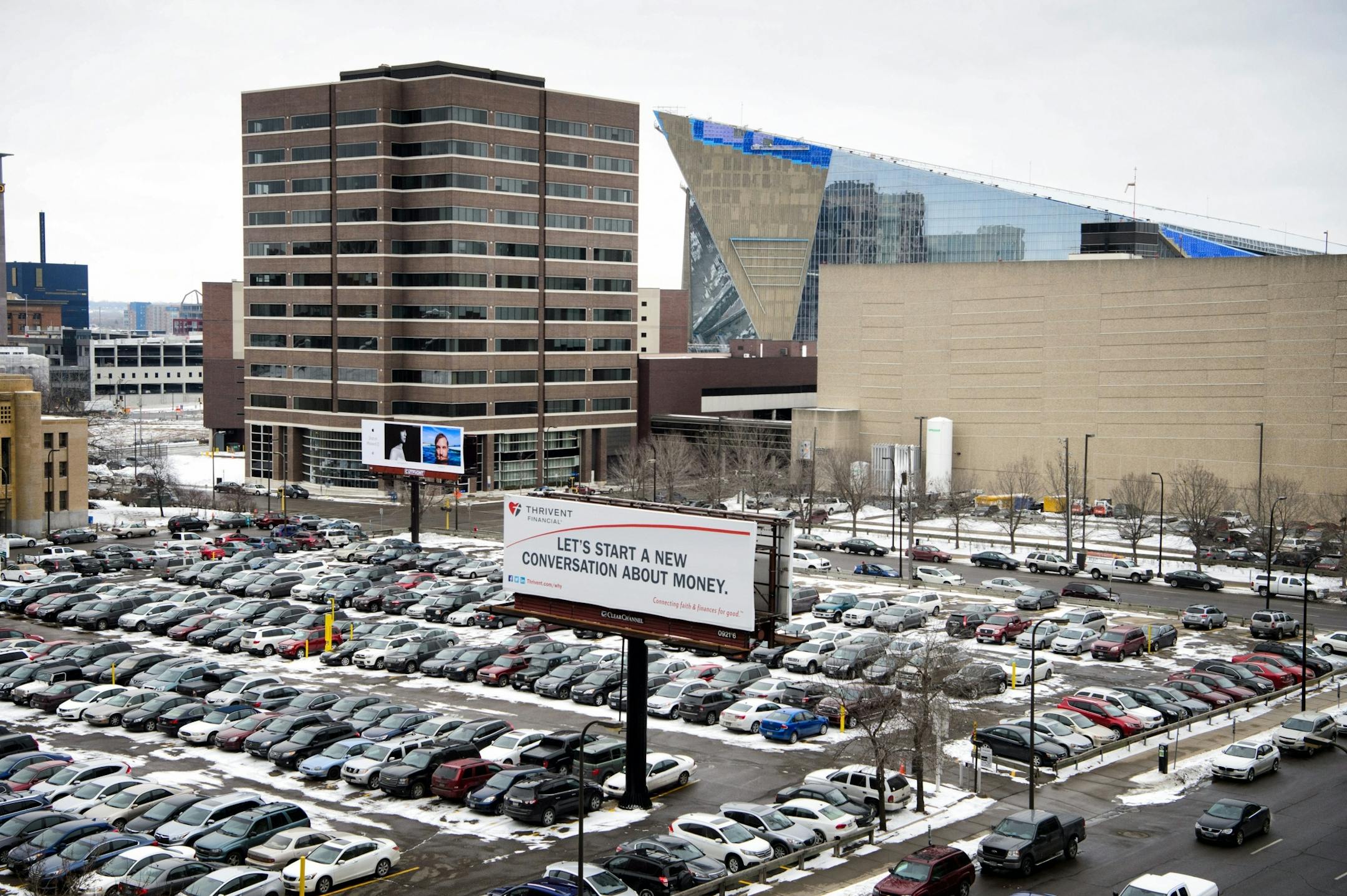 The Trivent surface parking lot at the corner of Portland Ave between 6th and 7th Streets.US Bank Stadium where the Minnesota Vikings will play in six months.