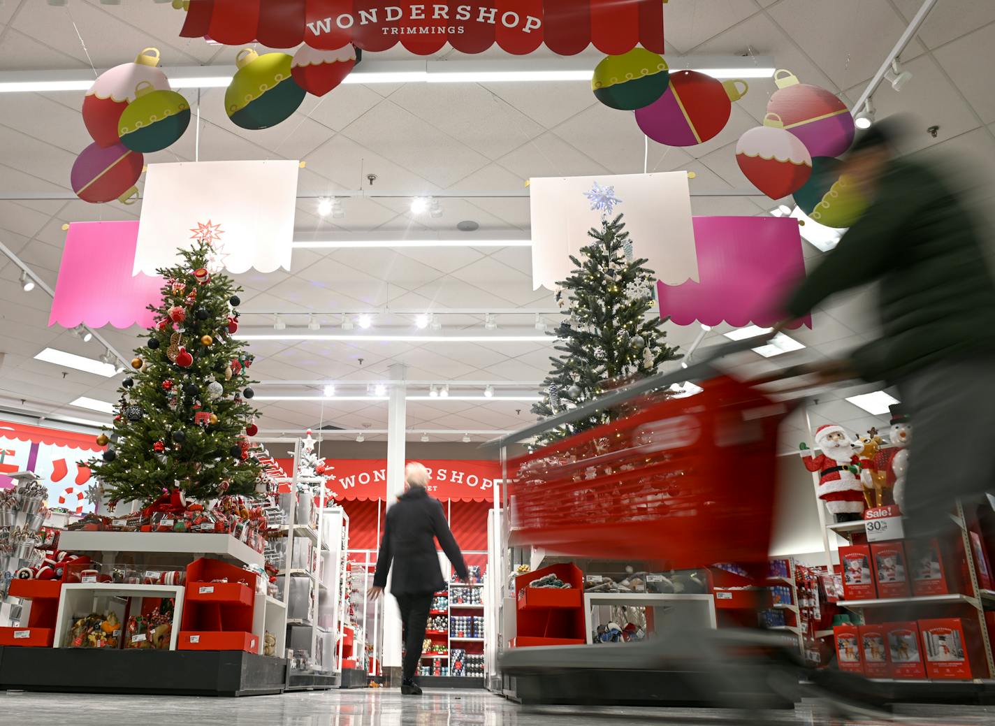 Kathryn Lindahl walked through the Ridgedale Target's "Wondershop" holiday display with her husband, Steve, Wednesday afternoon. They were shopping for "lights and any decorations we can find what will spruce up our place." ] Aaron Lavinsky &#xa5; aaron.lavinsky@startribune.com The unofficial kick-off to retailers' busiest season starts after the turkey is put back in the fridge on Thanksgiving. This send-up story will roll in the forecast for Minnesota from Deloitte and other expectations in th