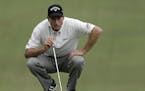 Jim Furyk lines up a putt on the 18th hole during the second round of the Wyndham Championship golf tournament in Greensboro, N.C., Friday, Aug. 19, 2