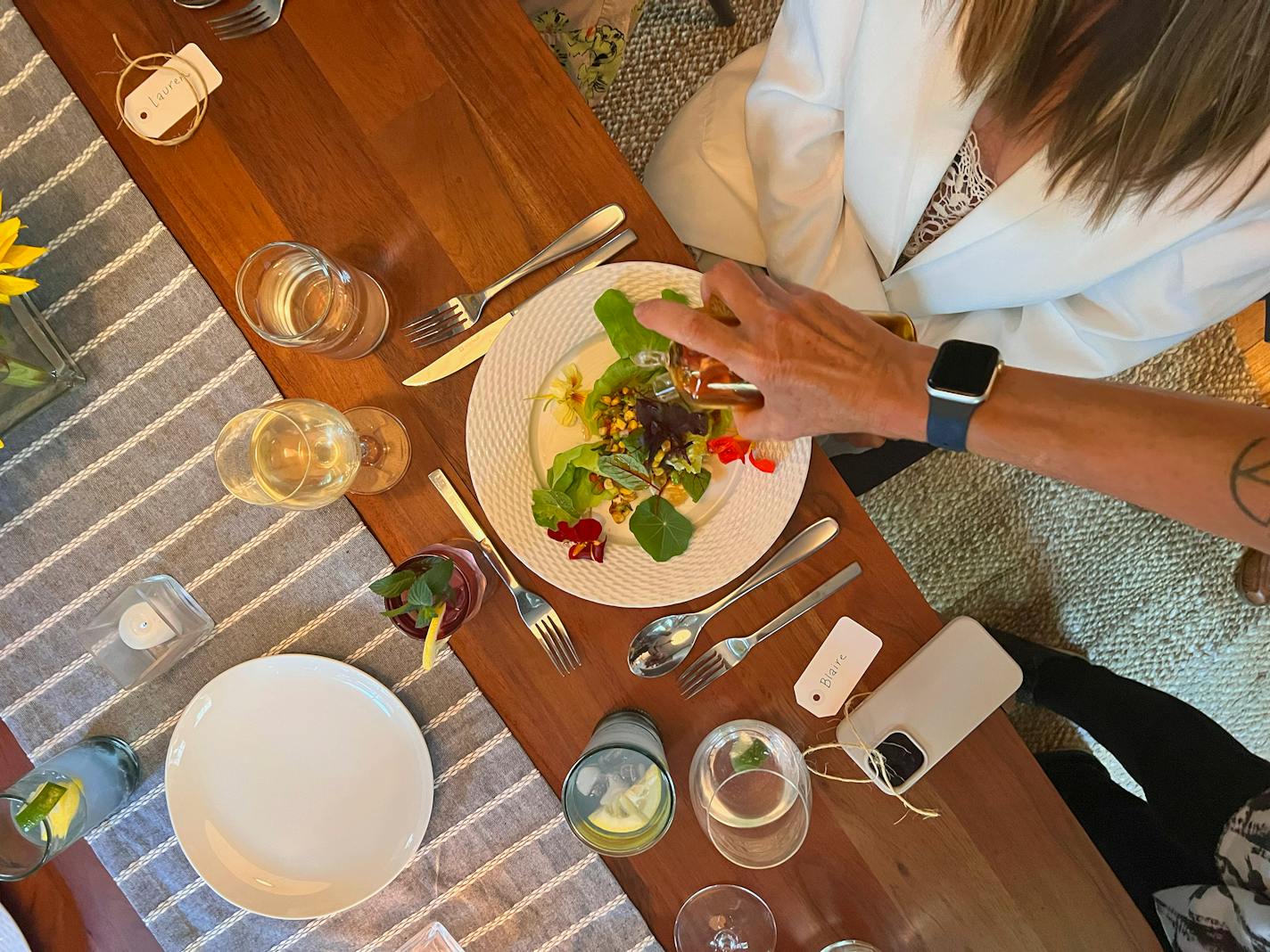 Dawn Drouillard finishes a summer succotash with El Mano Del Oro, an edible THC oil infused with smoke paprika, roasted garlic, and oregano. Credit: Patrick Duffy