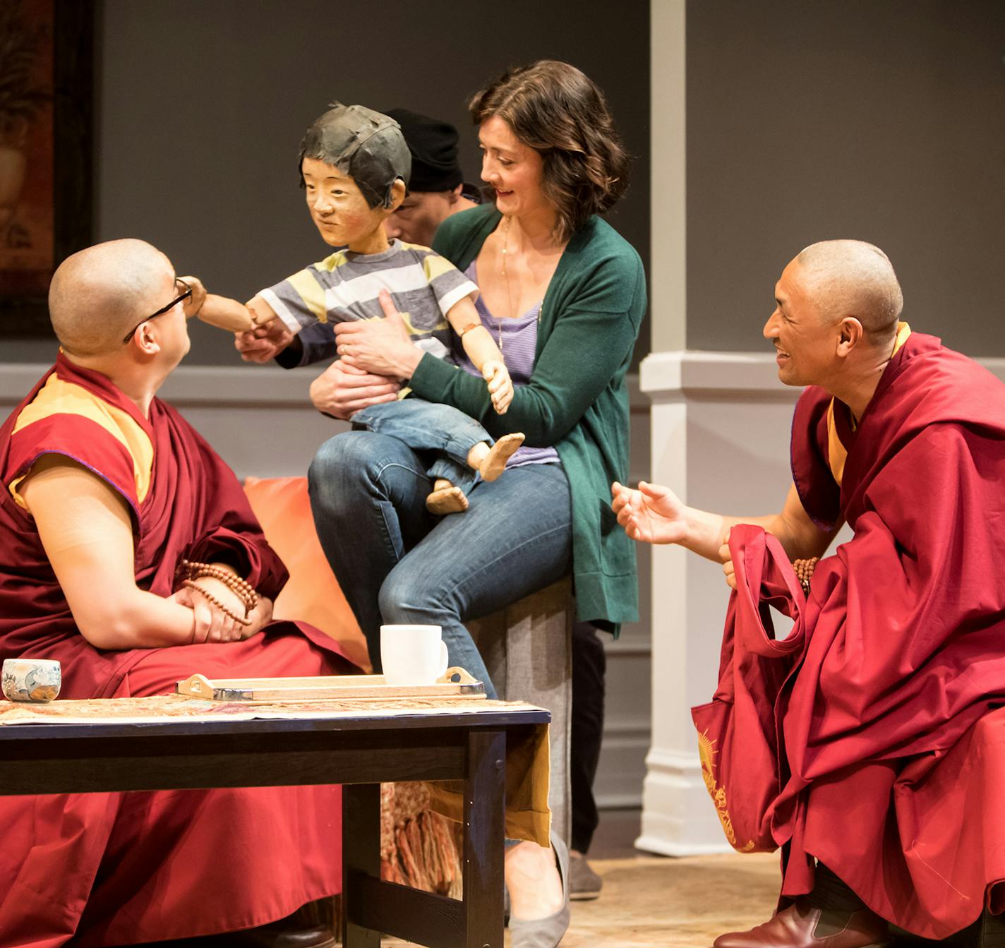 Eric &#xec;Pogi&#xee; Sumangil, Christina Baldwin, puppeteer Masanari Kawahara and Tsering Dorjee Bawa in "The Oldest Boy" at the Jungle Theater. PHOTO CREDIT: Dan Norman