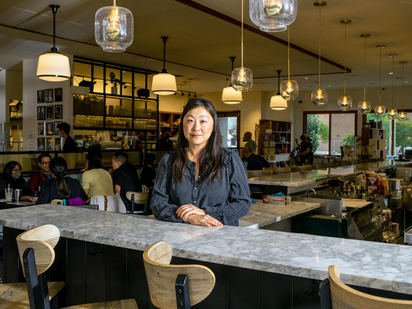 May Seto, owner of Grand Lake Kitchen, at her restayrant in Oakland, Calif., on June 25, 2021. Seto has accepted that delivery services will be a long-term part of her business. (Kelsey McClellan/The New York Times)