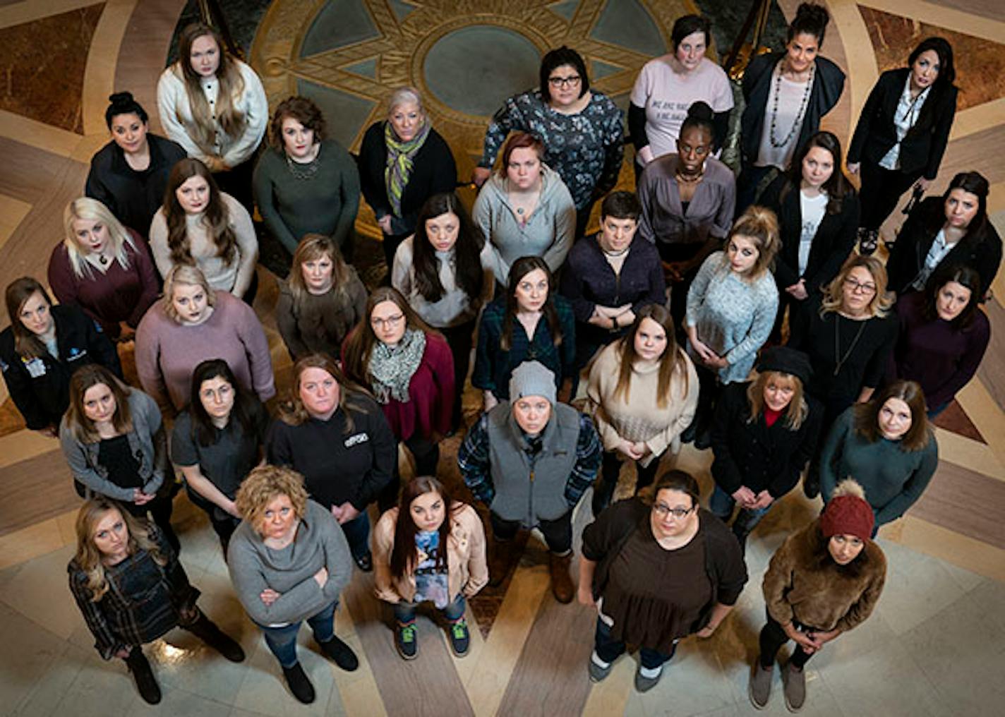 Group photo of participants in the Denied Justice series at the State Capitol in St. Paul, Minn., on December 22, 2018.