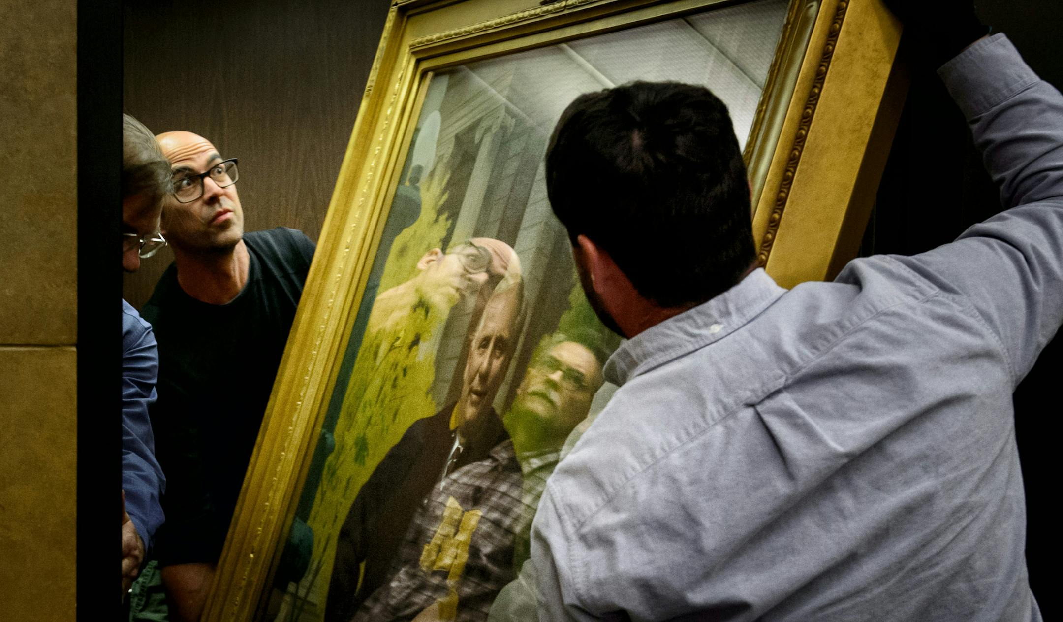 Underfoot the careful eye of the Minnesota Historical Society, a portrait of former Governor Arne Carlson is loaded into an elevator in the Capitol. ] GLEN STUBBE * gstubbe@startribune.com , Tuesday, May 19, 2015 Crews wasted no time clearing out furniture and artwork from the Minnesota State Capitol just hours after it was vacated by lawmakers who ended their session at midnight Monday.