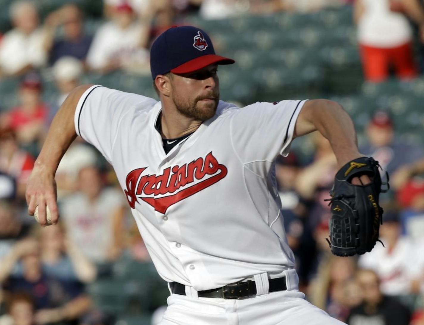 Cleveland Indians starting pitcher Corey Kluber delivers against the Kansas City Royals in the first inning of a baseball game, Friday, July 12, 2013, in Cleveland.