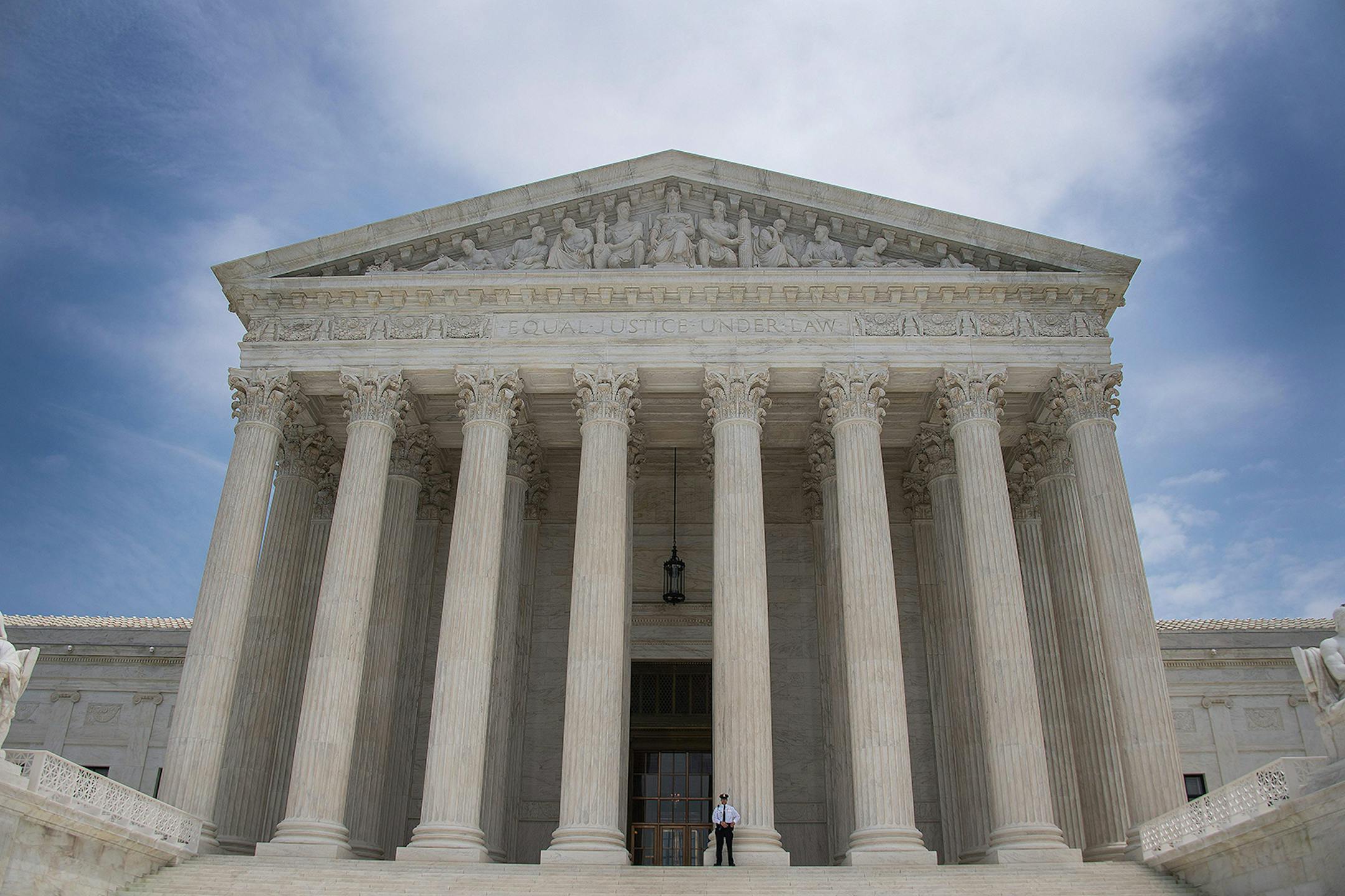 A police officer stands guard on the steps of the US Supreme Court in Washington, DC, June 15, 2017. (Jim Watson/AFP via Getty Images/TNS) ORG XMIT: 1504381