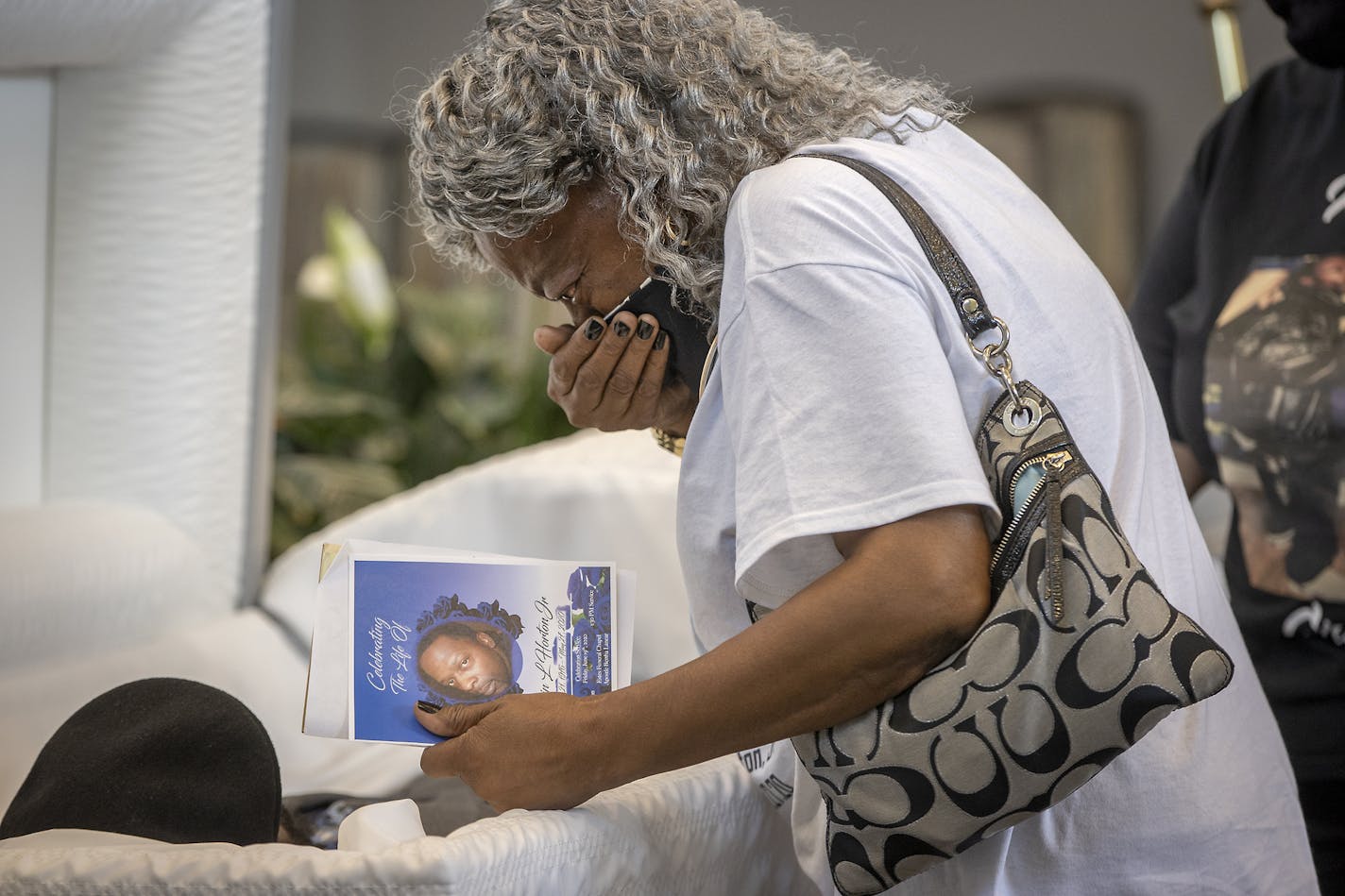 Mae Roberts said her last farewell to her son Calvin L. Horton Jr. after his funeral at Estes Funeral Chapel, Friday, June 19, 2020 in Minneapolis, MN. Horton was shot and killed by John Richard Rieple, a pawn broker. Police found Horton lying on the sidewalk in front of the shop near Bloomington and Lake on the second night of civil unrest in the aftermath of the killing of George Floyd at the hands of Minneapolis police. ] ELIZABETH FLORES • liz.flores@startribune.com