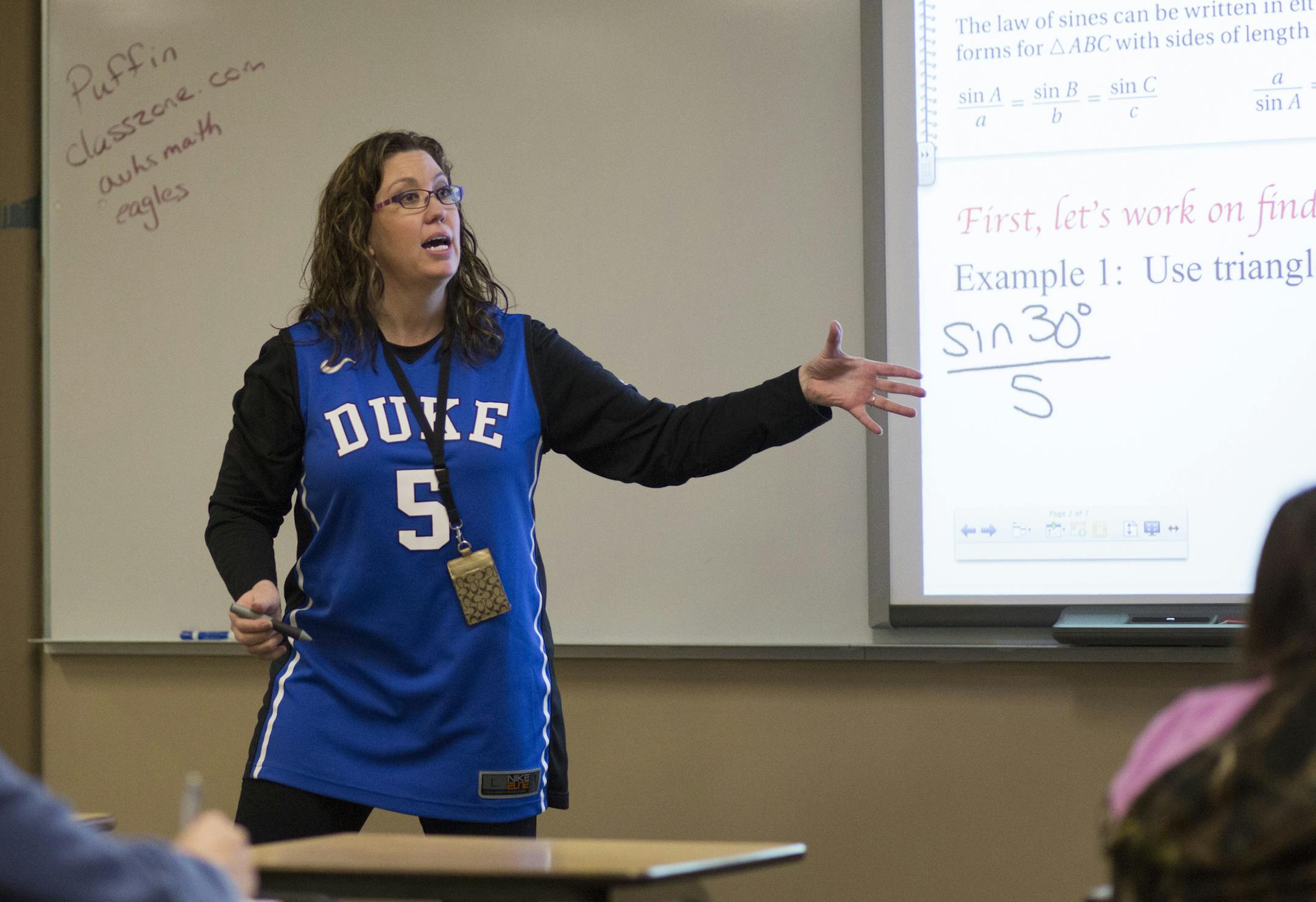 Showing her support for former student, and now national champion Tyus Jones, Algebra teacher Michelle Lundquist wore her Duke jersey Tuesday while teaching at Apple Valley High School. ] BRIAN PETERSON ï brianp@startribune.com Apple Valley, MN - 4/6/2015
