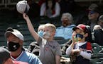 Minnesota Twins fans Jake Renner, 6, and Cameron Leapaldt, 5, from Chanhassen, during a game against the Texas Rangers on Thursday, May 6, 2021 at Tar