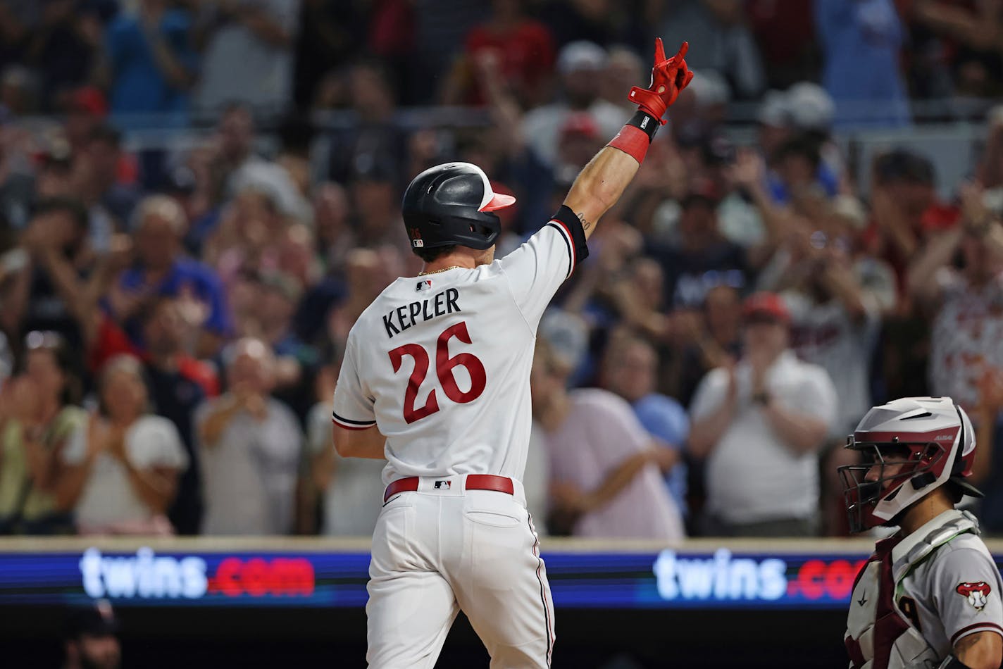 Minnesota Twins' Max Kepler (26) celebrates his home run against the Arizona Diamondbacks during the sixth inning of a baseball game Friday, Aug. 4, 2023, in Minneapolis. (AP Photo/Stacy Bengs)