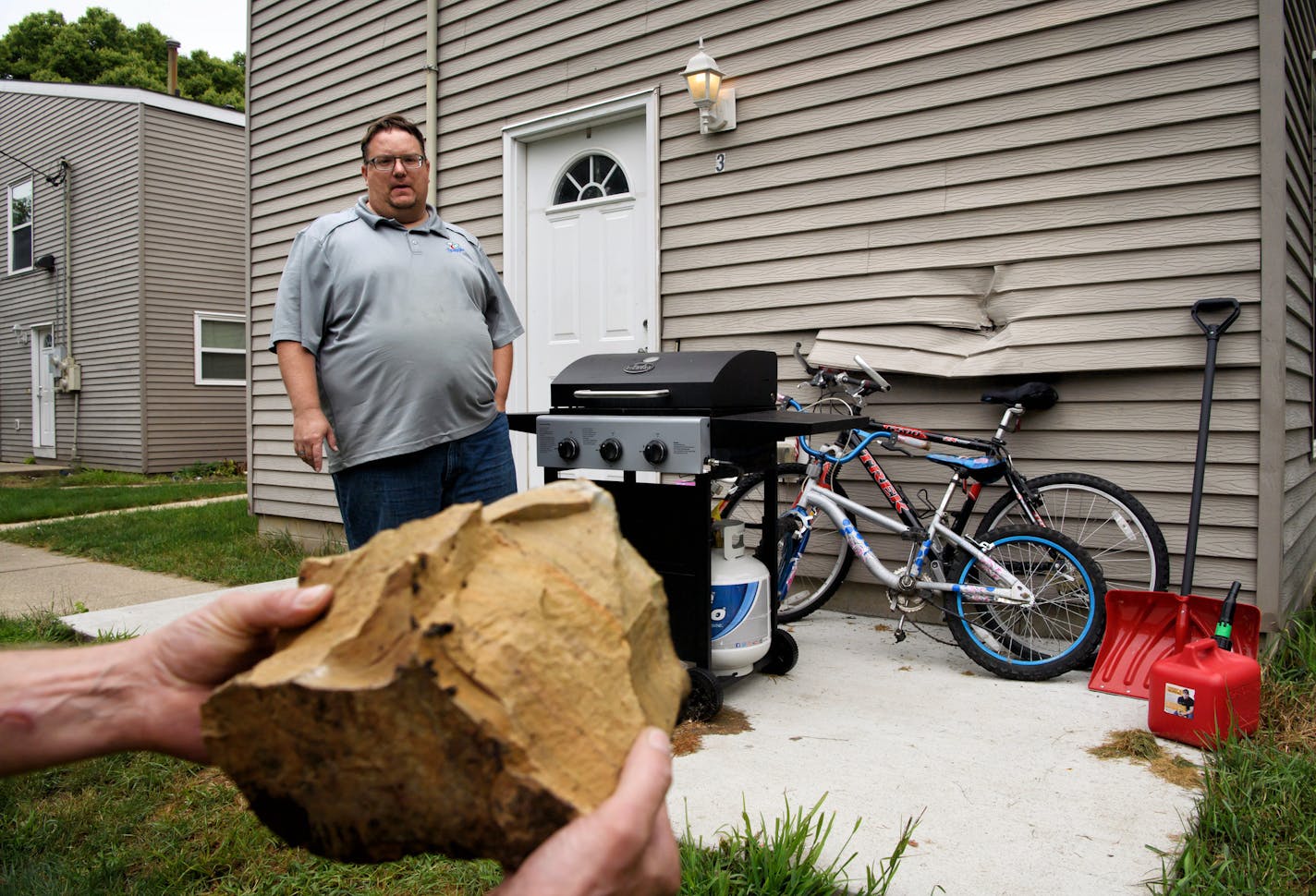 David Kreiselmeier found a dent in the back of his Mankato home after a quarry blast sent chunks of limestone into the surrounding Germania Park neighborhood. This rock just missed his kids&#x2019; bicycles.