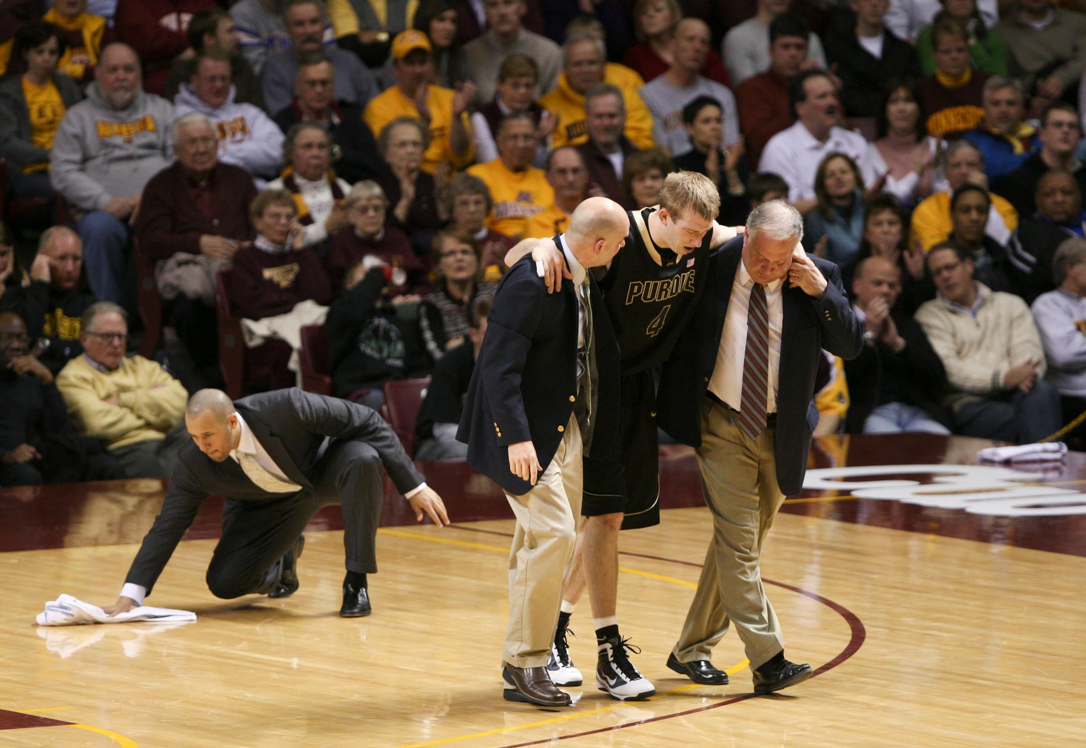 Purdue's Robbie Hummel was helped off the court after injuring his right leg taking a first half shot Wednesday night. He did not return to the game.