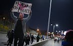 Protesters took to Hwy 94 to protest the election of Donald Trump.They cited racism amongst the issues on which they disagreed with him vehemently. ] 