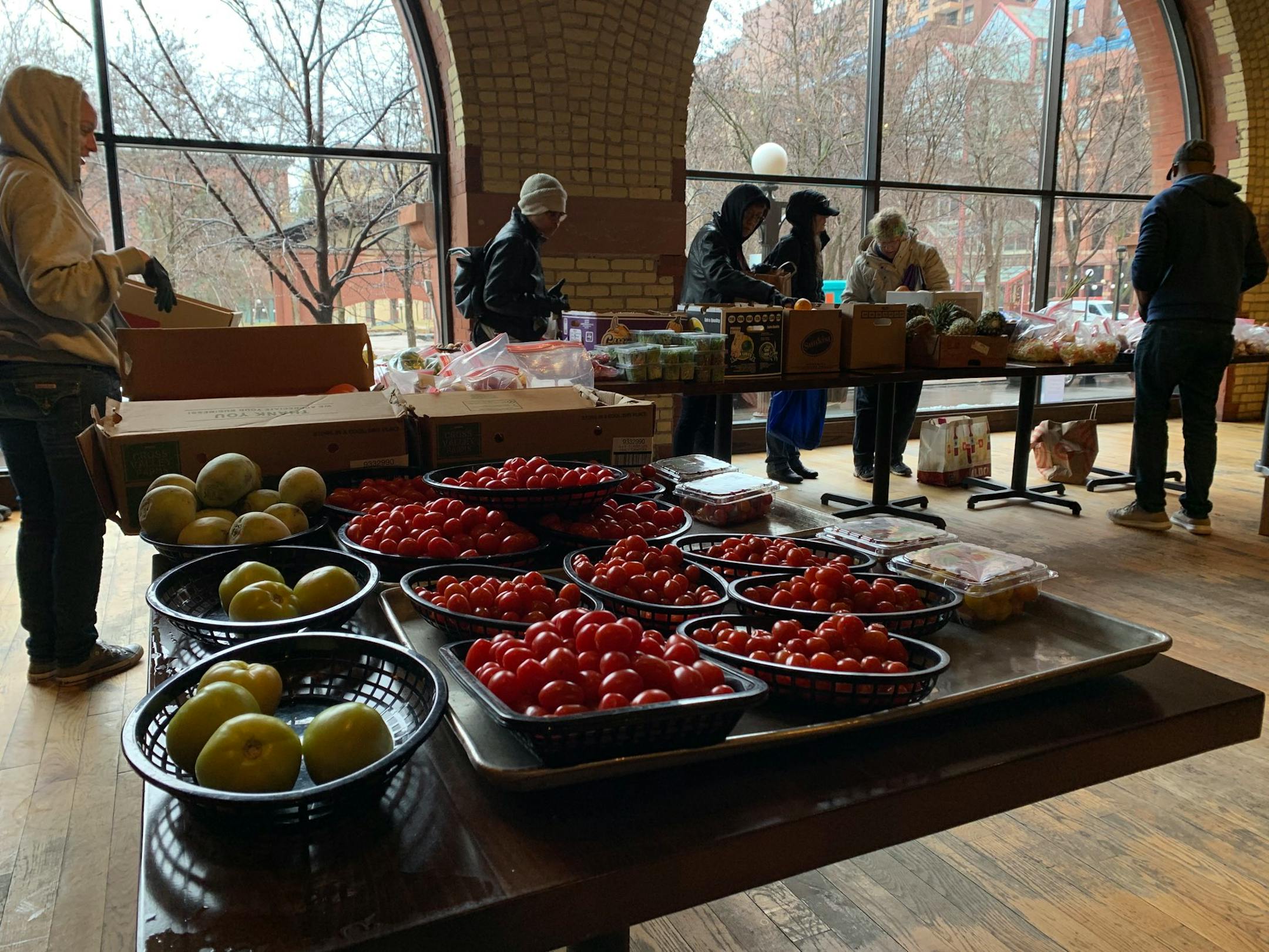 Twin Cities restaurants emptied their kitchens to give the food away at Public Kitchen + Bar in downtown St Paul to anyone who needed it.