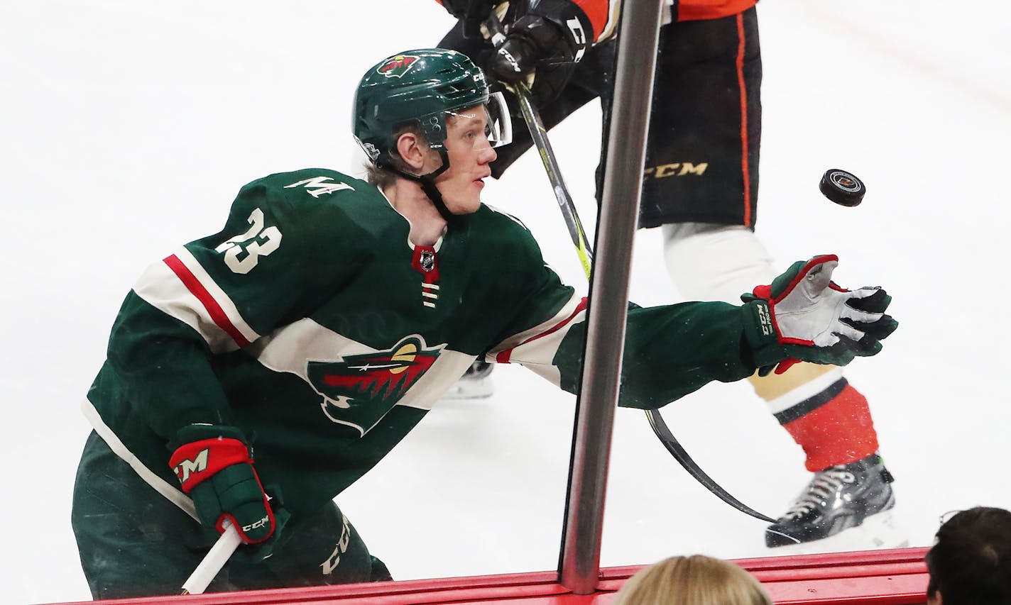 The Minnesota Wild's Gustav Olofsson (23) tries to glove the puck against Anaheim. The Ducks went on for a 3-2 win over the Wild Saturday, Feb. 17, 2018, at the Xcel Energy Center in St. Paul, MN.Saturday, Feb. 17, 2018, at the Xcel Energy Center in St. Paul, MN. ] DAVID JOLES &#xef; david.joles@startribune.com Wild versus Anaheim