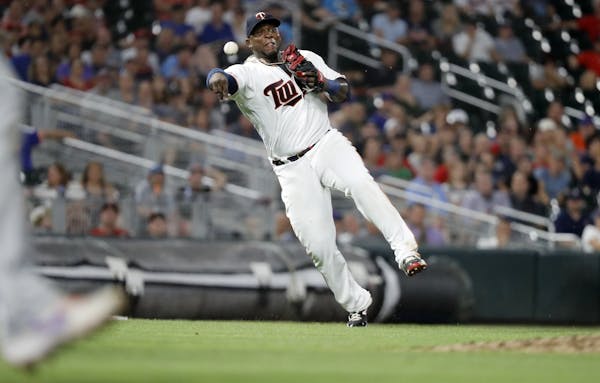 Minnesota Twins third baseman Miguel Sano (22) throws the ball to first base for an out in the eighth inning.
