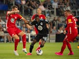 Minnesota United forward Emmanuel Iwe (42) slipped between two FC Kaiserslautern defenders in Wednesday’s 2-1 friendly victory at Allianz Field.