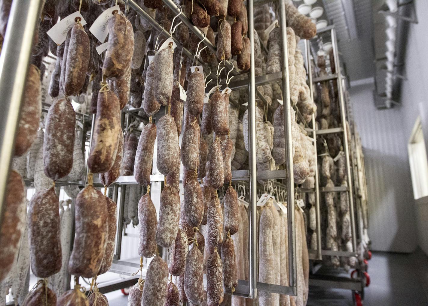 Salami hangs in the aging room in the Red Table Meat Co. production facility at Food Building in Minneapolis March 20, 2015. (Courtney Perry/Special to the Star Tribune)