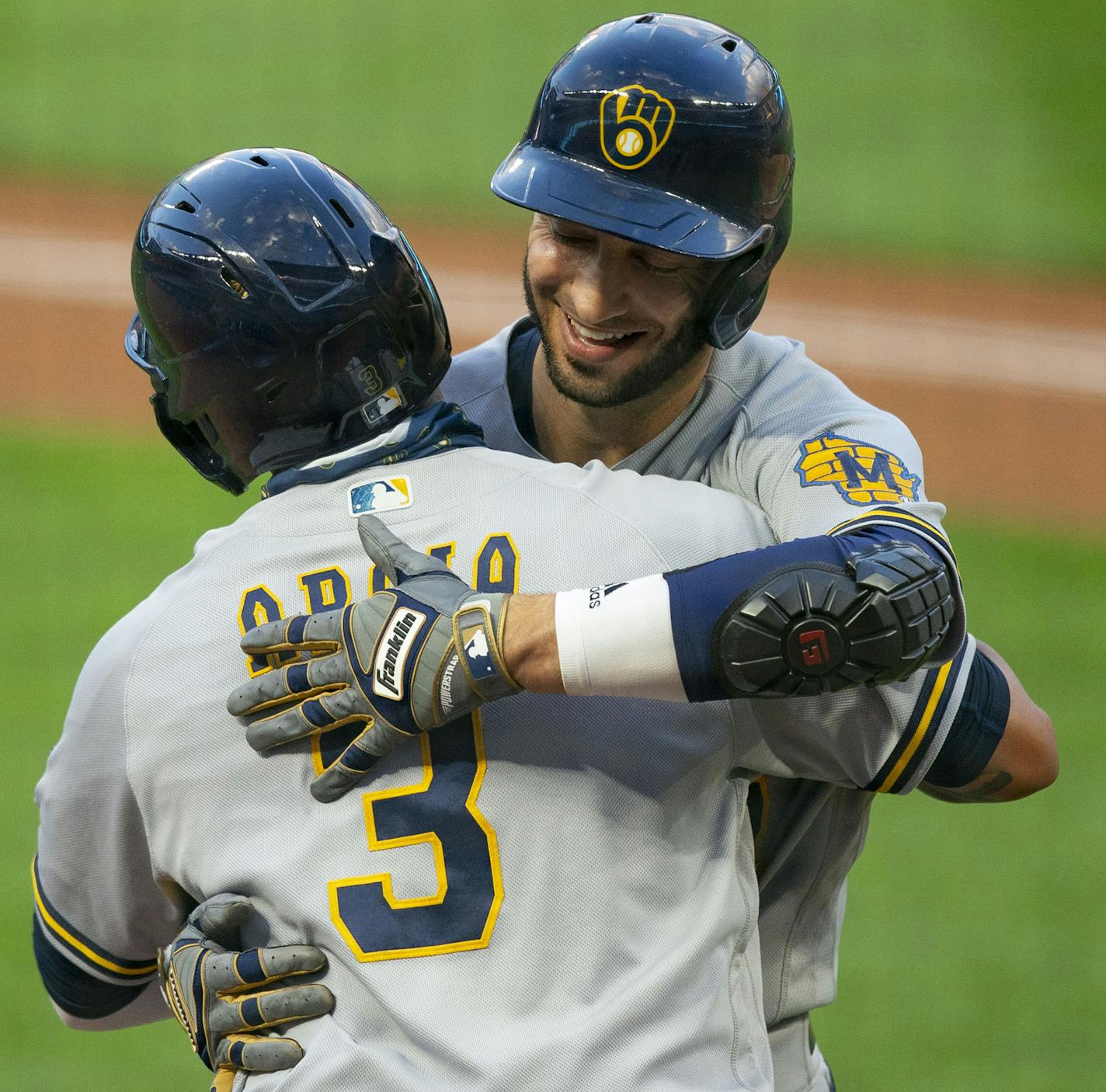 Milwaukee Brewers right fielder Ryan Braun (8) was embraced by Milwaukee Brewers shortstop Orlando Arcia (3) after Braun hit a two run home run to take the lead in the third inning. ] ALEX KORMANN • alex.kormann@startribune.com The Minnesota Twins took on the Milwaukee Brewers on Wednesday August 19, 2020 at Target Field in Minneapolis.