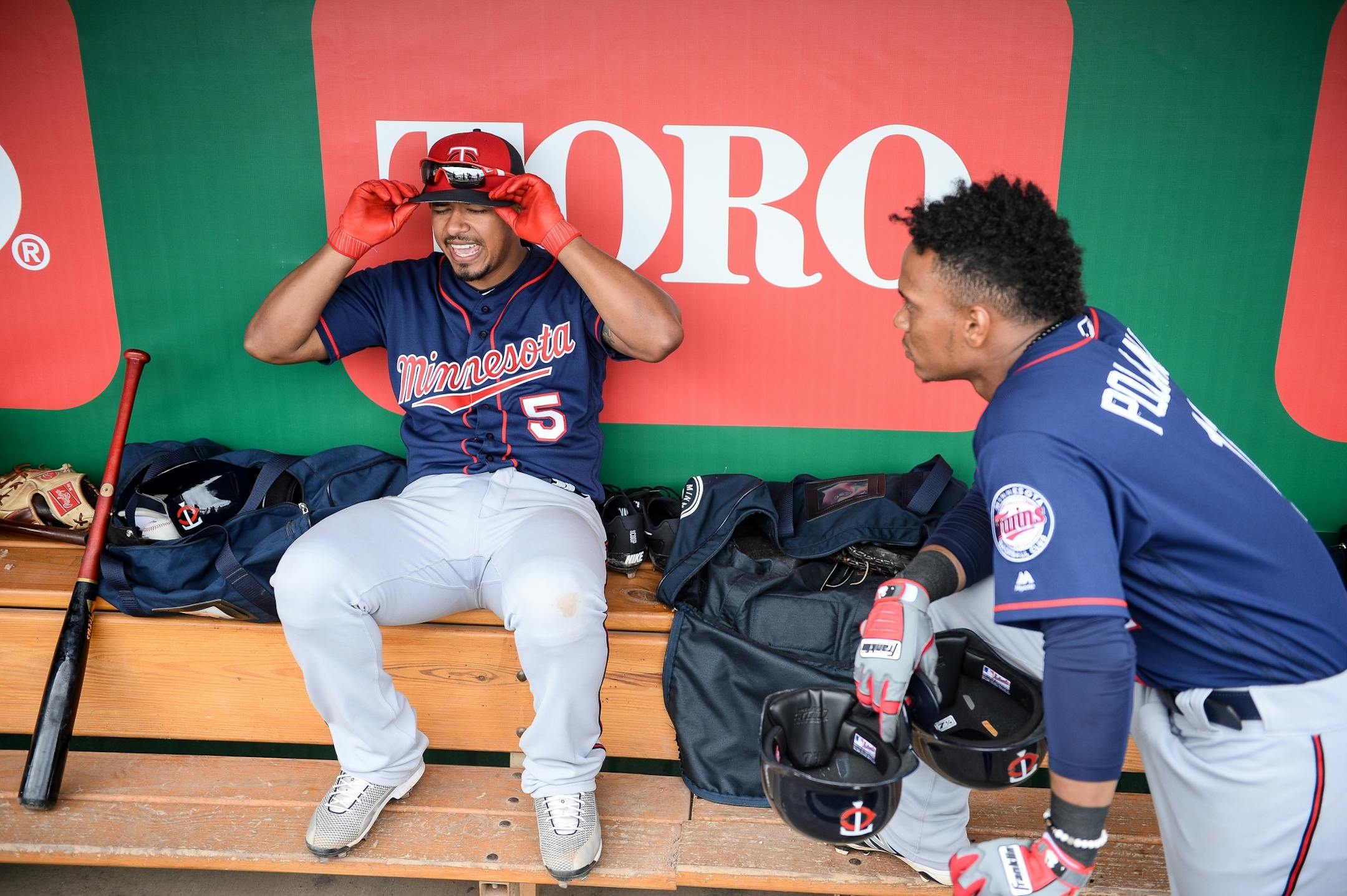 Minnesota Twins shortstop Jorge Polanco (11) looked on as fellow shortstop Eduardo Escobar (5) sang along with music from Michael Jackson being played on the loudspeakers at Hammond Stadium.