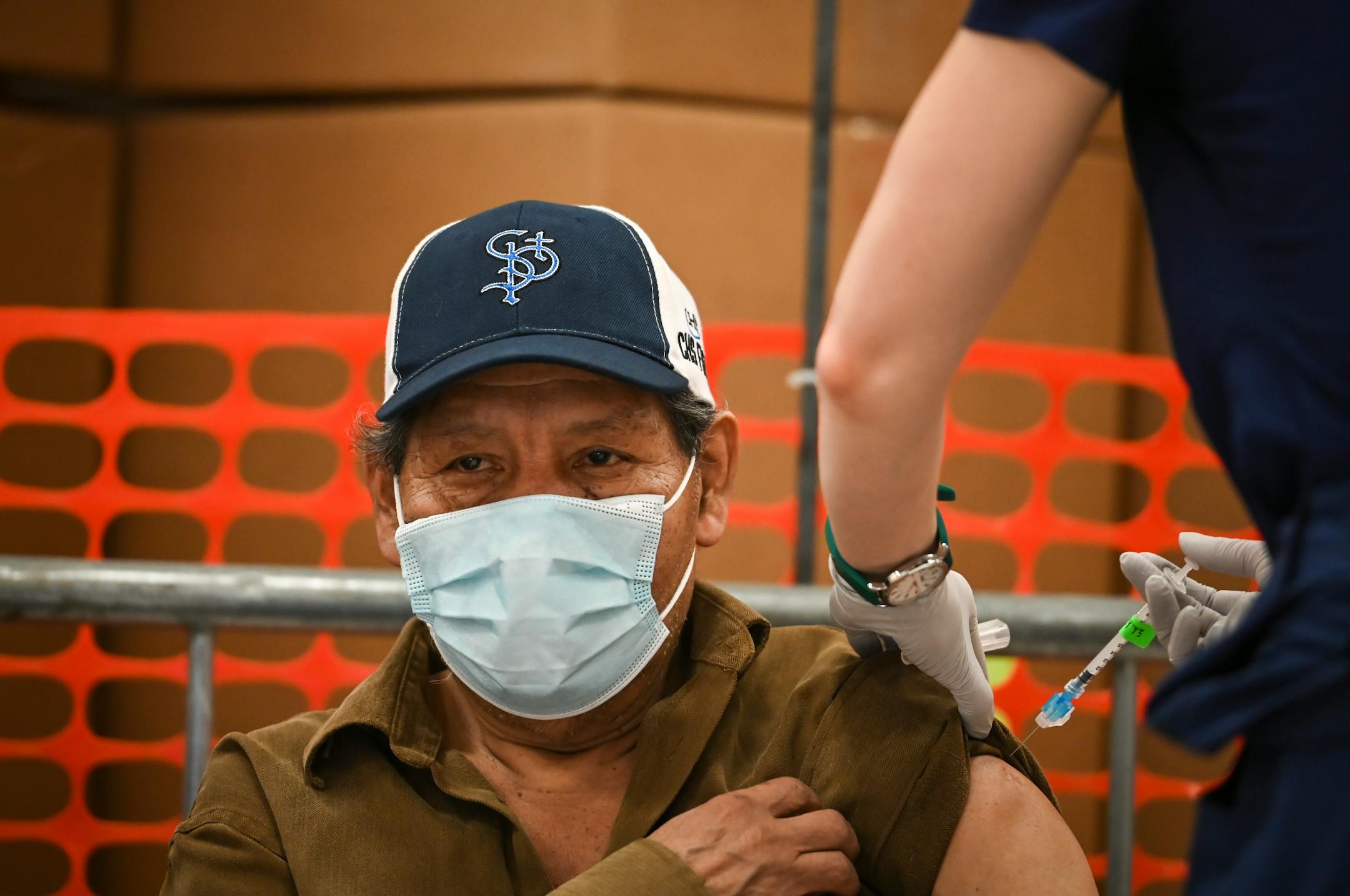 Alvaro Mendez, 70, received a dose of the Moderna COVID-19 vaccine at North Memorial Health Hospital's vaccination clinic in Brooklyn Center.