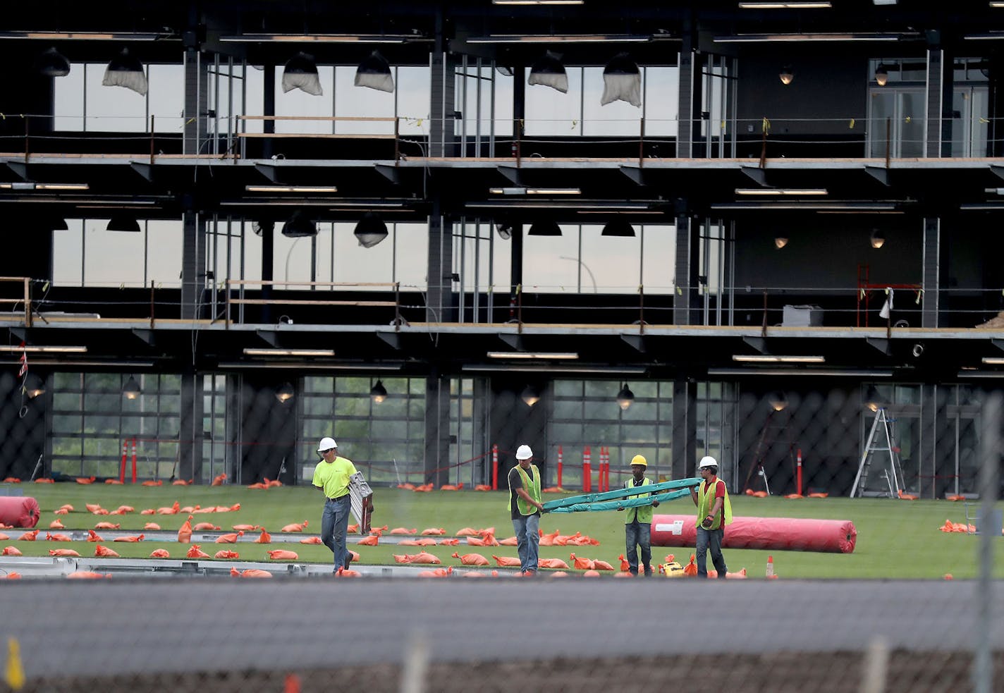 A multi-tiered golf driving range called Topgolf is staging "ambition auditions" for the 500 or so jobs they need to fill before opening the high-tech center later this year in Brooklyn Center. Here, workers on the site Tuesday, July 201, 2018, in Brooklyn Center, MN.] DAVID JOLES &#xef; david.joles@startribune.com A multi-tiered golf driving range called Topgolf is staging "ambition auditions" for the 500 or so jobs they need to fill before opening the high-tech center later this year in Brookl