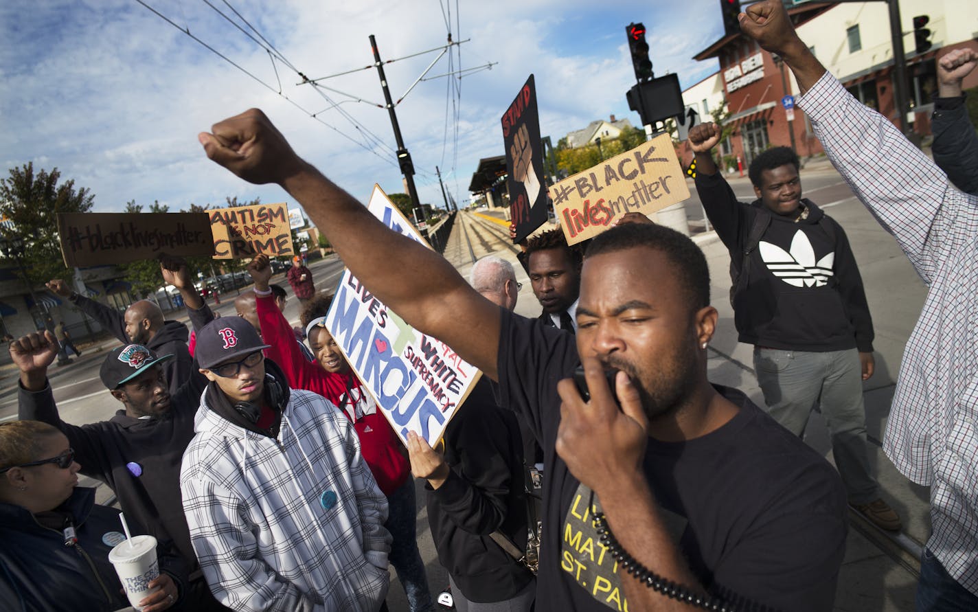 Near the Lexington light rail station in St. Paul, protesters with Black Lives Matters blocked traffic to and from TCF Stadium on the home opener for the Vikings. Organizer Rashad Turner, front, led the event.]Richard Tsong-Taatarii/rtsong-taatarii@startribune.com