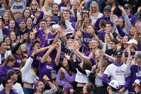 The St. Thomas student section reached out for a free T-shirt during the Sept. 25 home opener against Butler.
