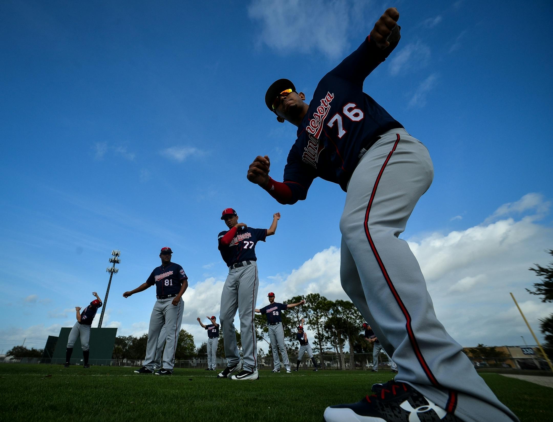 Minnesota Twins players, including pitcher Felix Jorge (76) stretched at the start of practice Thursday.