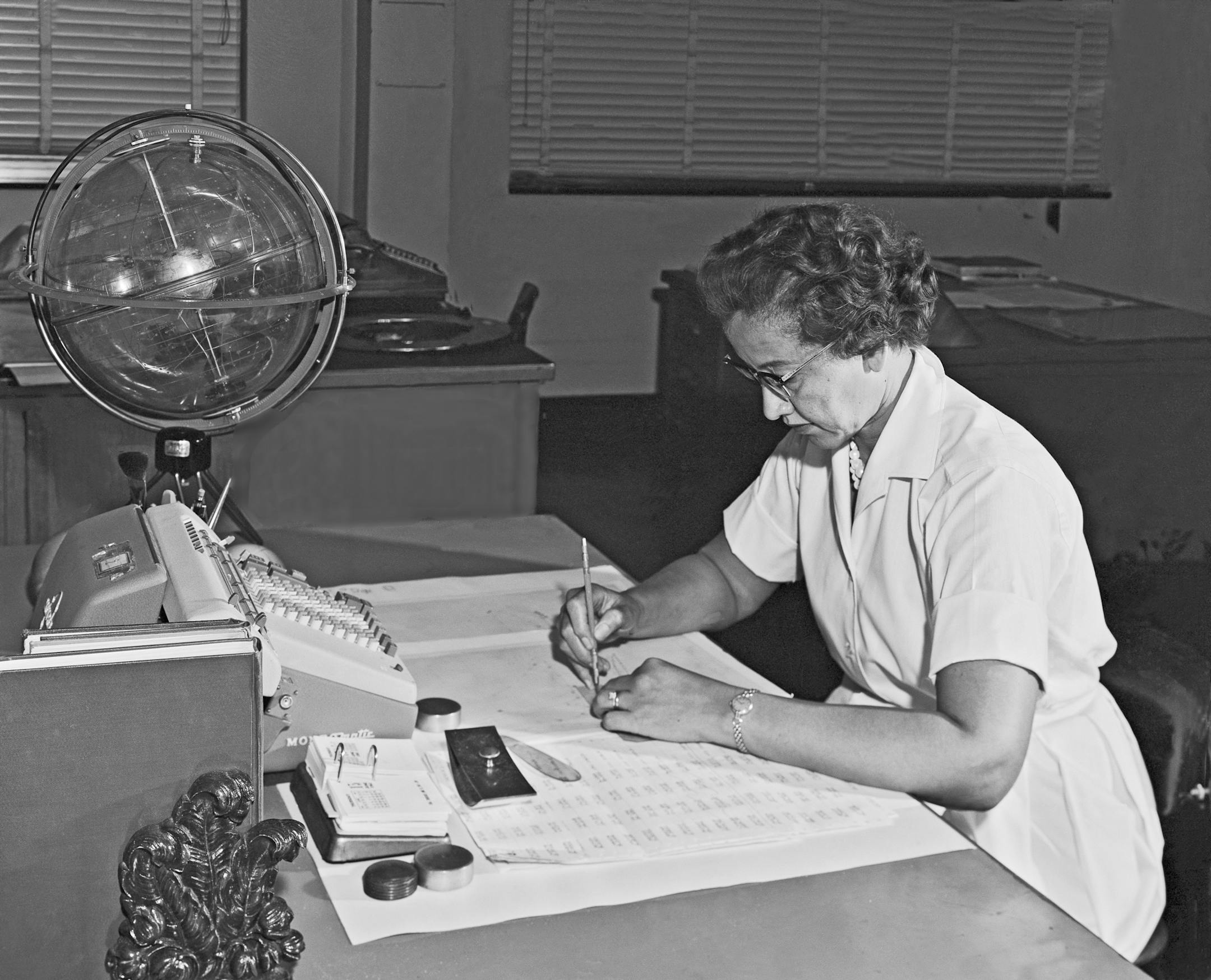 FILE -- In an undated photo provided by NASA, Katherine Johnson at her desk at NASA's Langley Research Center in Hampton, Va. Johnson, one of a group of black women mathematicians at NASA and its predecessor who were celebrated in the 2016 movie "Hidden Figures," died on Monday, Feb. 24, 2020, in Newport News, Va. She was 101. (NASA via The New York Times) -- FOR EDITORIAL USE ONLY