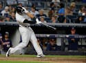 New York Yankees' Aaron Hicks hits a home run during the eighth inning of a baseball game against the Minnesota Twins on Friday, June 24, 2016, in New