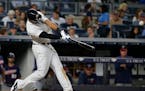 New York Yankees' Aaron Hicks hits a home run during the eighth inning of a baseball game against the Minnesota Twins on Friday, June 24, 2016, in New
