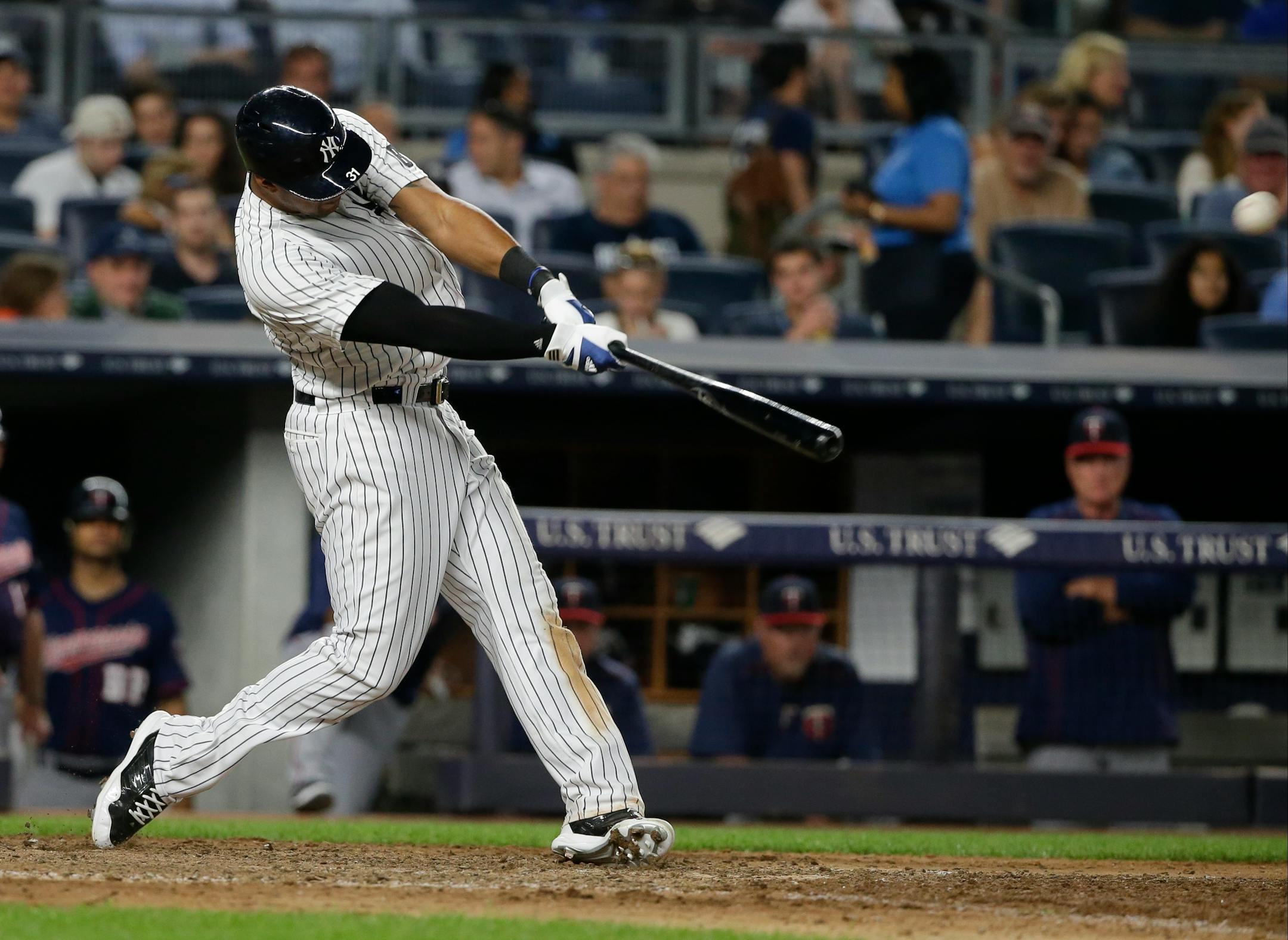 New York Yankees' Aaron Hicks hits a home run during the eighth inning of a baseball game against the Minnesota Twins on Friday, June 24, 2016, in New York. The Yankees won 5-3.