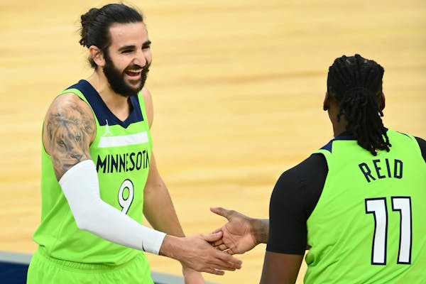 Minnesota Timberwolves guard Ricky Rubio (9) high fived center Naz Reid (11) after Reid’s buzzer-beating 3-pointer to end the first quarter against 