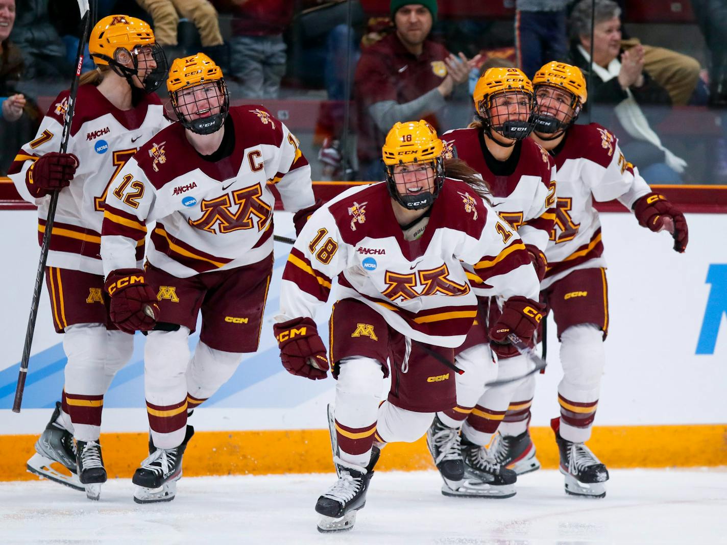 Abbey Murphy (18) leads teammates back to the Gophers bench after scoring in the third period as Minnesota took a 2-0 lead over Minnesota Duluth in an NCAA Tournament game Saturday, March 11. The Gophers beat Duluth 3-0 to advance to the Frozen Four. Photo by Eric Miller, University of Minnesota