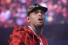 FILE - In this June 7, 2015, file photo, rapper Chris Brown performs at the 2015 Hot 97 Summer Jam at MetLife Stadium in East Rutherford, N.J. Brown a
