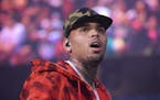 FILE - In this June 7, 2015, file photo, rapper Chris Brown performs at the 2015 Hot 97 Summer Jam at MetLife Stadium in East Rutherford, N.J. Brown a