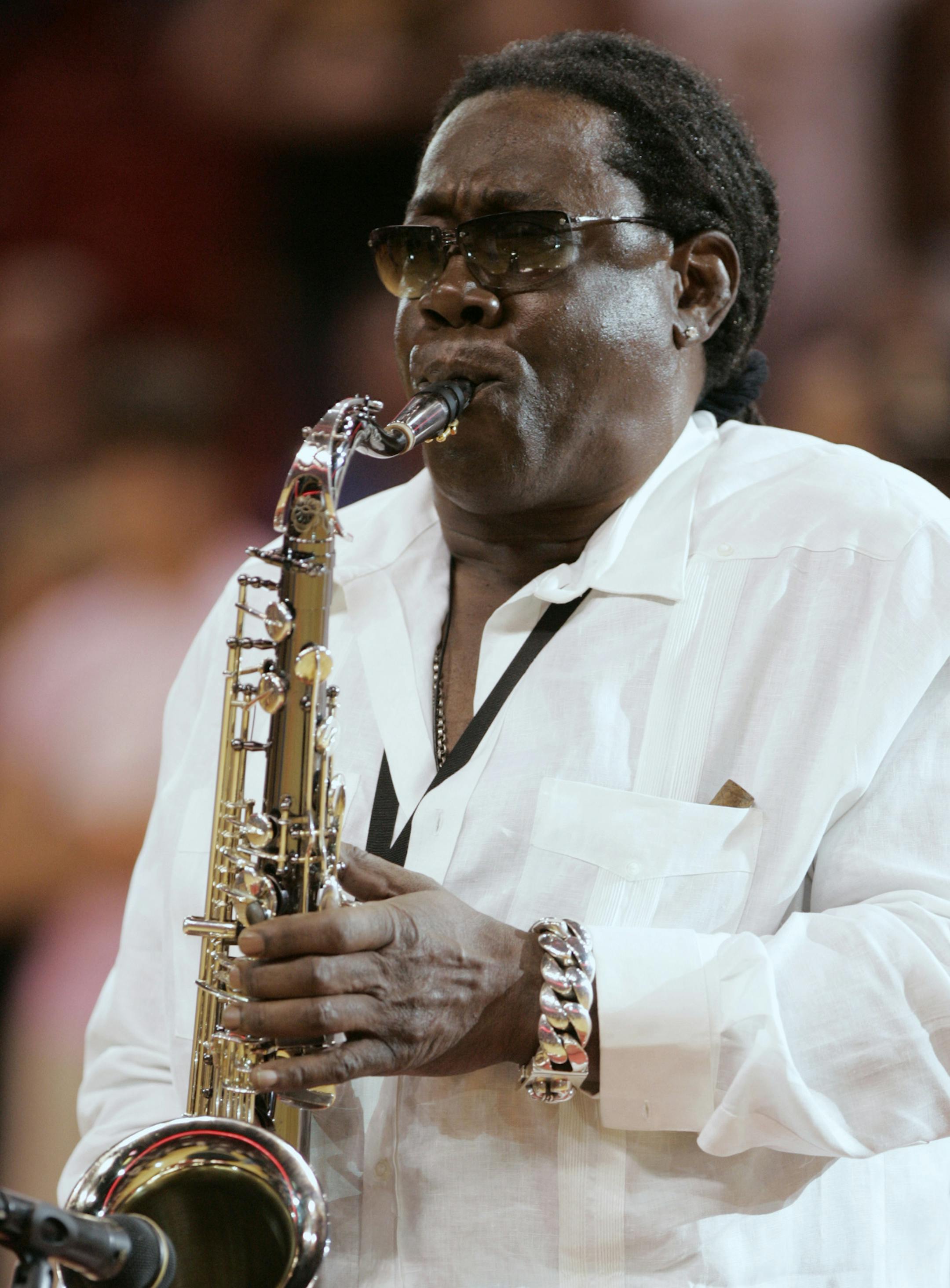 In this Feb. 10, 2008 photo, Clarence Clemons plays the national anthem before a basketball game between the Miami Heat and Los Angeles Lakers in Miami. A spokeswoman for Bruce Springsteen and the E Street Band says saxophone player Clarence Clemons has died in Florida at age 69. (AP Photo/Lynne Sladky)