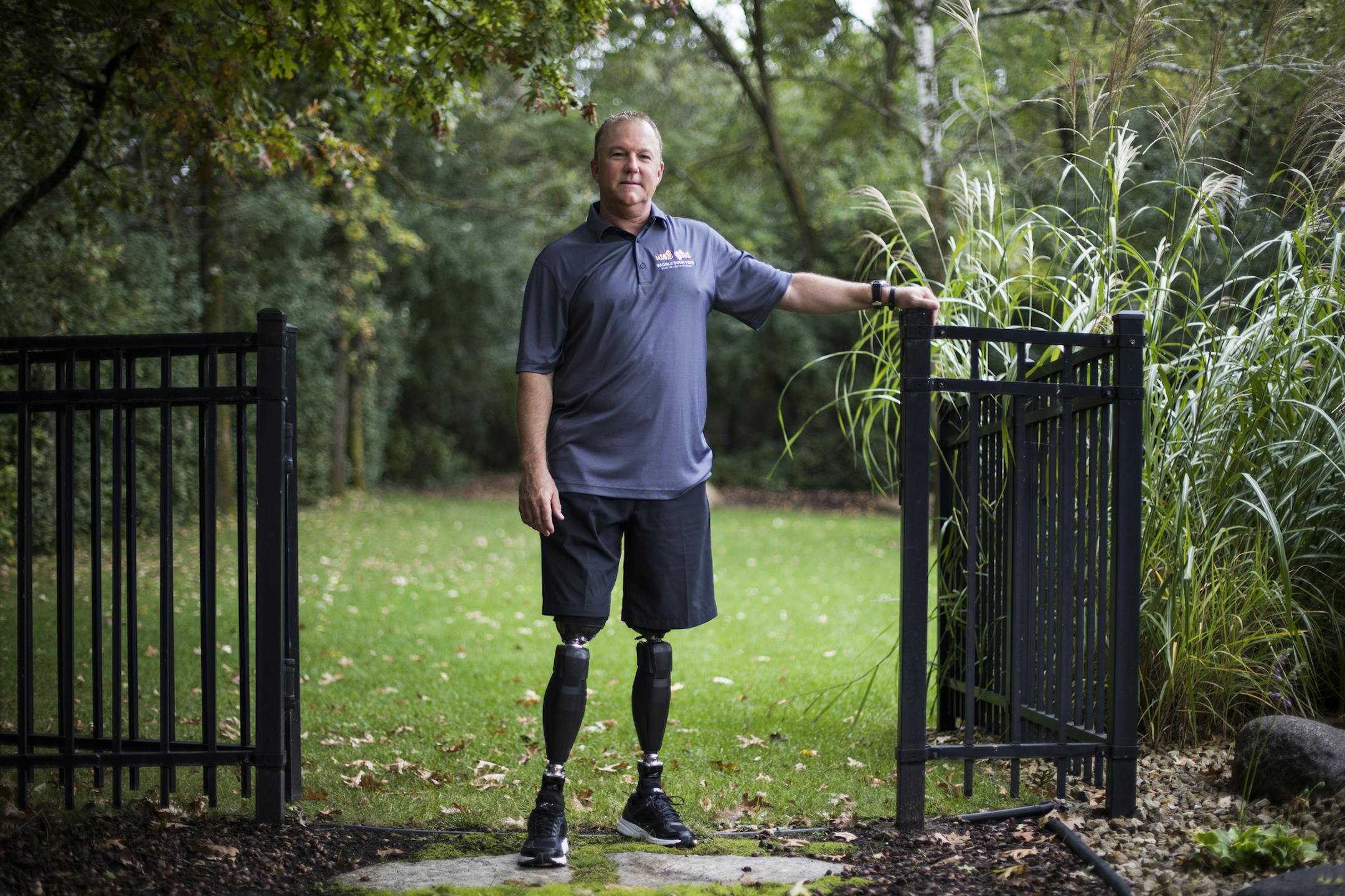 Aaron Holm photographed outside his home in Shakopee.