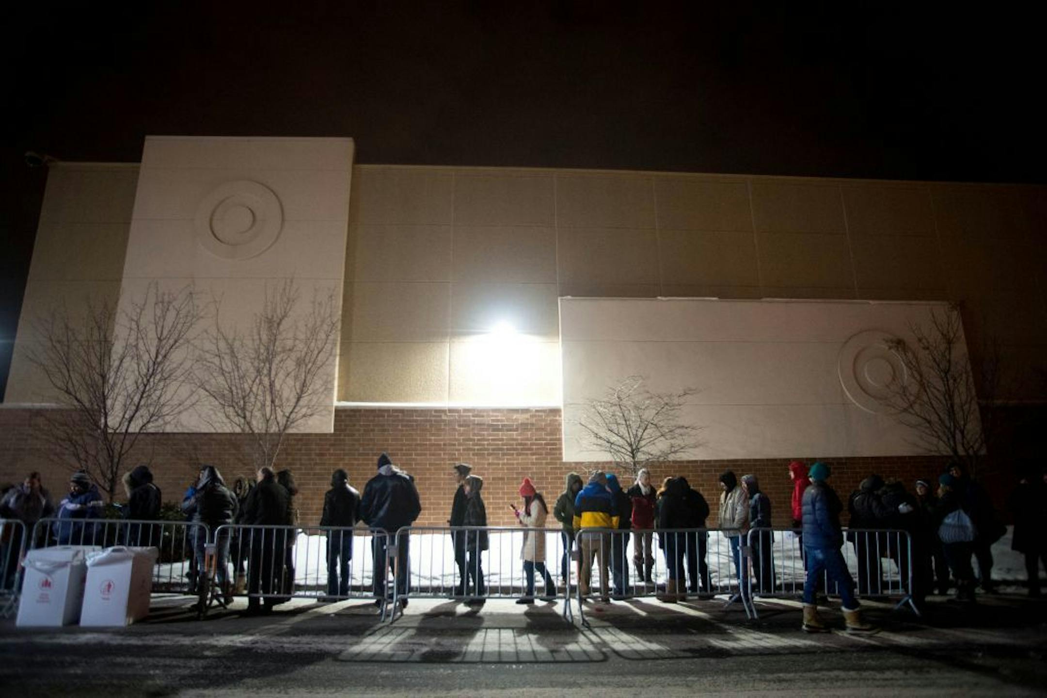 Dozens of shoppers line up outside the Super Target in Roseville to get early deals on Thanksgiving night.