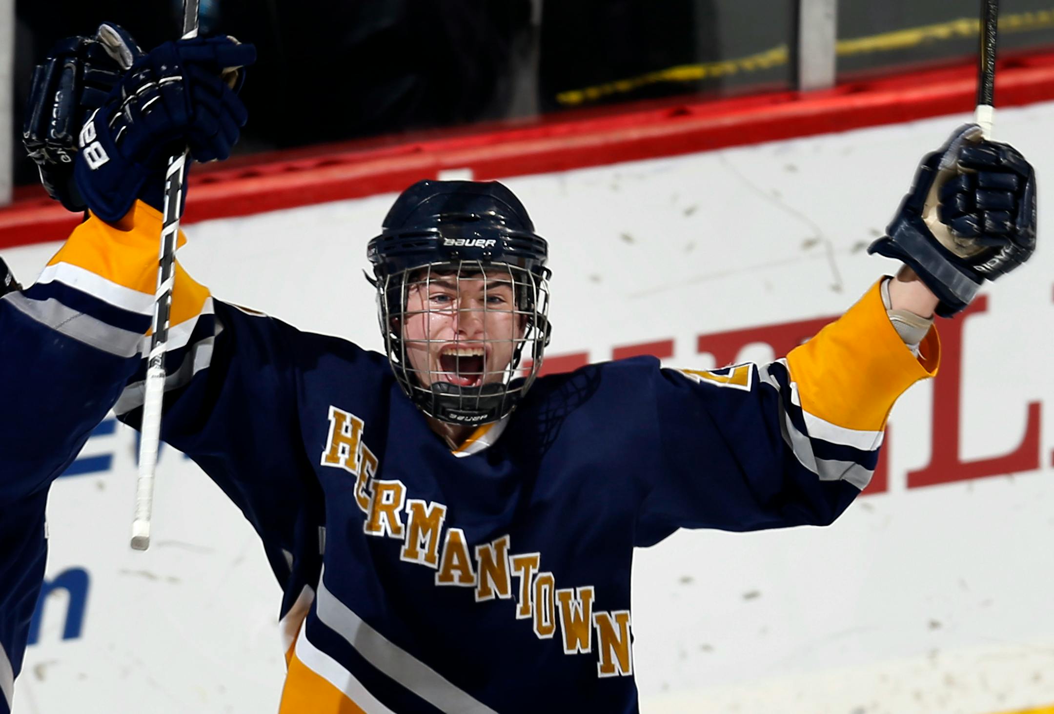Scott Wasbotten (23) celebrated his goal in the second period during the 2013 Class 1A boys' hockey tournament in St. Paul.