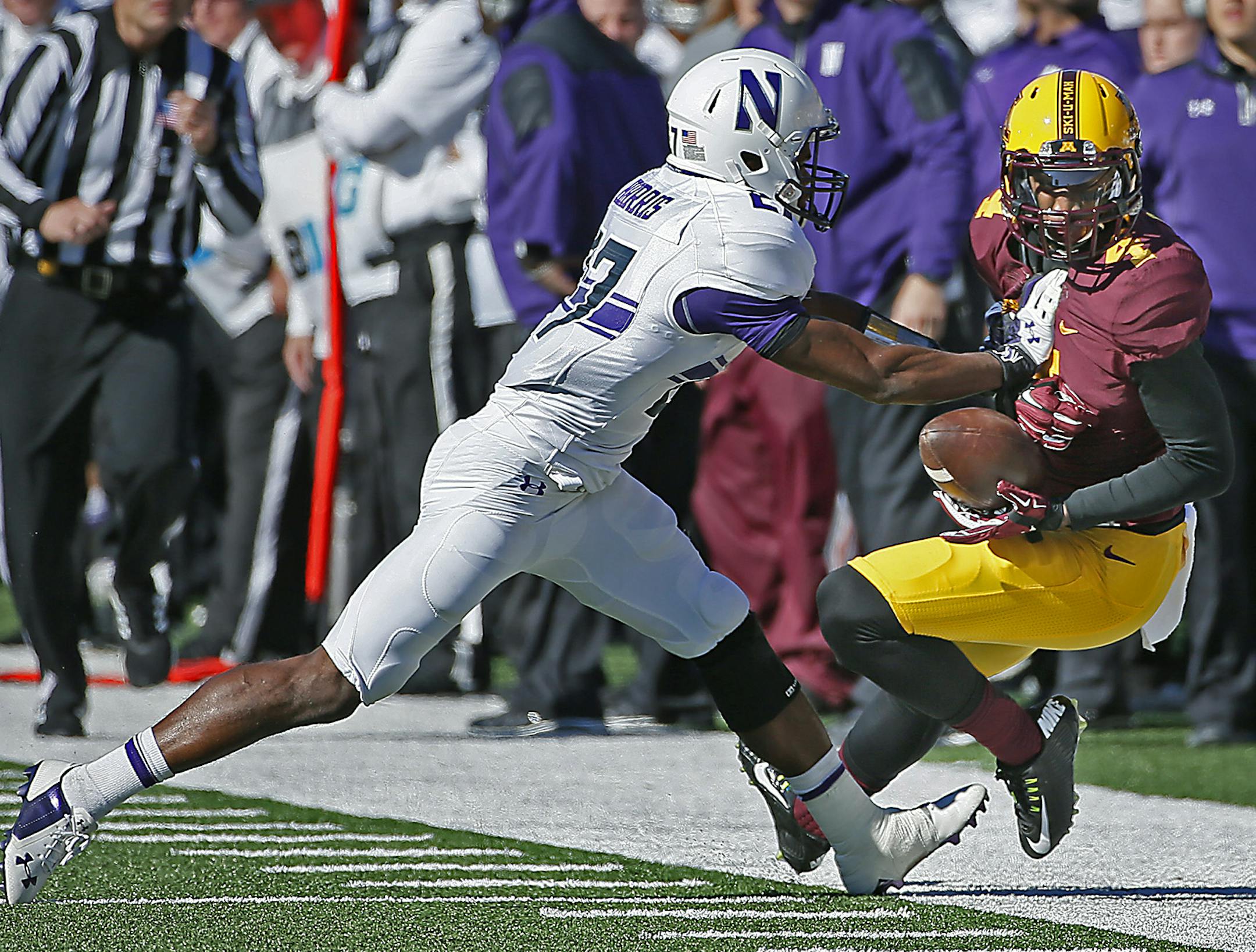 Gophers wide receiver Donovahn Jones (4) was pushed out of bounds by Northwestern cornerback Matthew Harris (27) after making a grab quarter as the Minnesota Gophers took on the Northwestern Wildcats at TCF Stadium, Saturday, October 11, 2014 in Minneapolis, MN. ] (ELIZABETH FLORES/STAR TRIBUNE) ELIZABETH FLORES • eflores@startribune.com