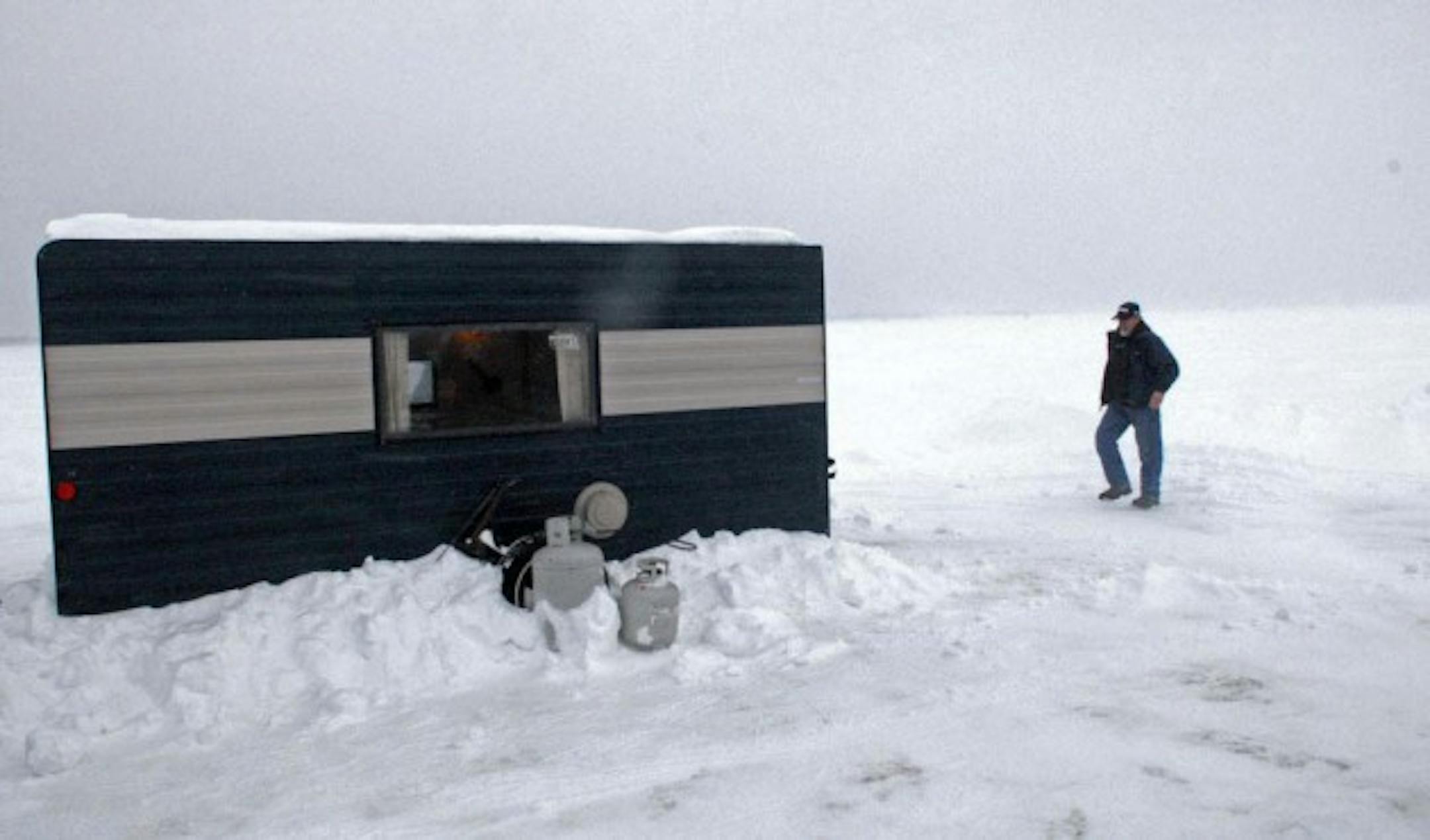Spider Johnson origianlly is from the Willmar area, but has for many years now guided on giant Upper Red Lake in northwest Minnesota, where he also rents fish houses in winter. On Sunday, during a near whiteout on the lake driven by high winds, he checked on one of his houses.