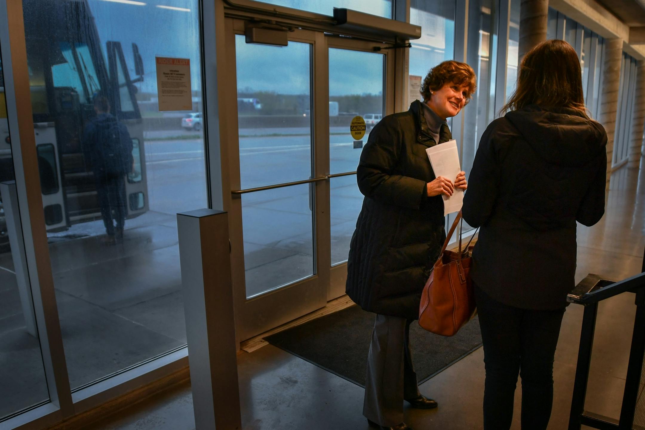 Maureen Failor of the Bloomington Chamber of Commerce offered leaflets to morning commuters at Kenrick Avenue Park-n-Ride in Lakeville, urging them to call their legislators about a proposed 40 percent reduction in transit funding.