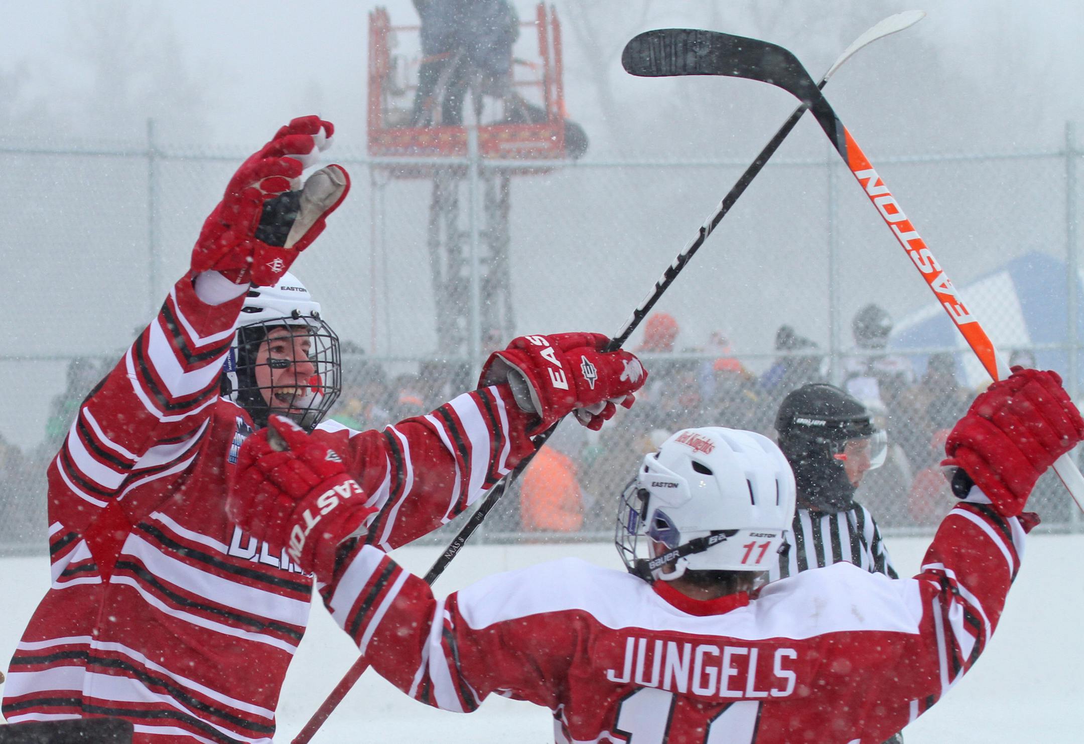 (left to right) Benilde-St. Margaret's Spencer Naas celebrated his goal against Grand Rapids, with Chase Jungels during the second game of Hockey Day Minnesota on the shores of Lake Pokegama in Grand Rapids on 1/19/13. At this point in the day the weather was getting bad with dropping temps and blowing winds.] Bruce Bisping/Star Tribune bbisping@startribune.com Spencer Naas, Chase Jungels/roster.