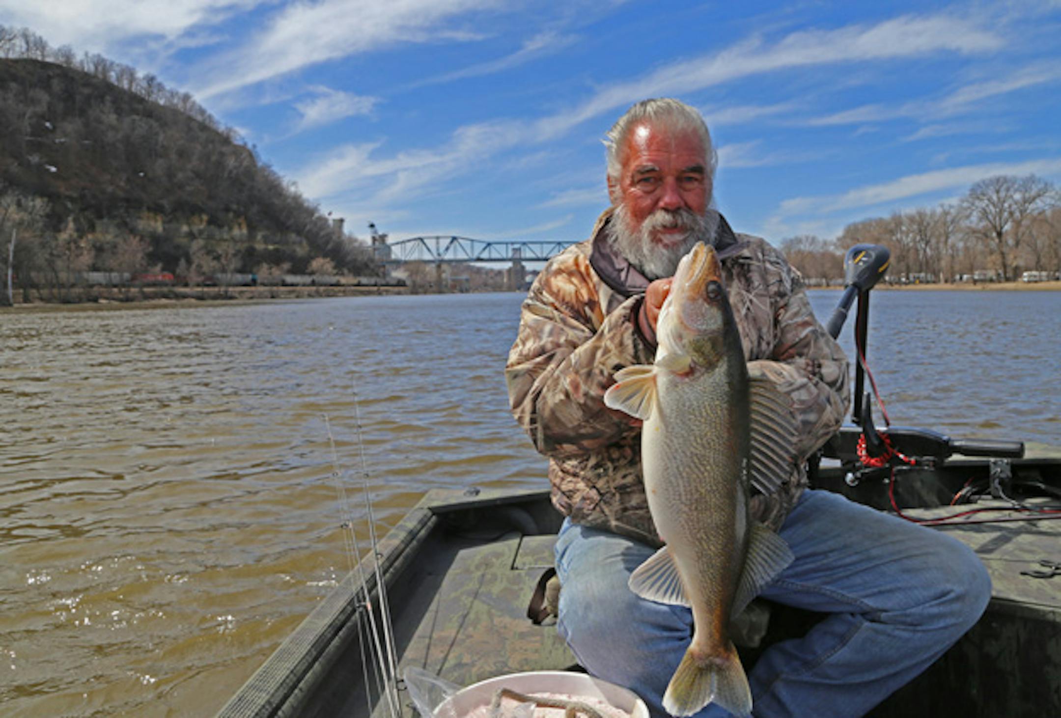 Guide Dick "Griz'' Grzywinski of St. Paul with a 9-pound walleye he caught Thursday while fishing the Mississippi River near Red Wing, Minn.