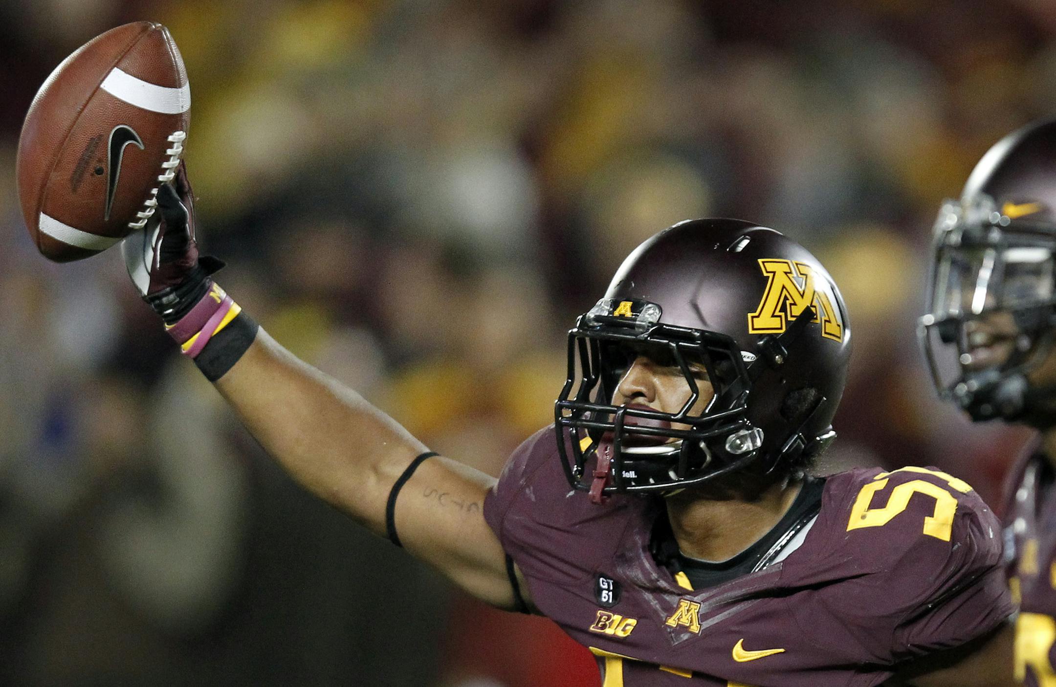 Aaron Hill (51) celebrated after recovering a fumble in the third quarter. ] CARLOS GONZALEZ cgonzalez@startribune.com - September 22, 2012, Minneapolis, Minn, TCF Bank Stadium, NCAA, University of Minnesota Gophers vs. Syracuse Orange ORG XMIT: MIN1209222252050072
